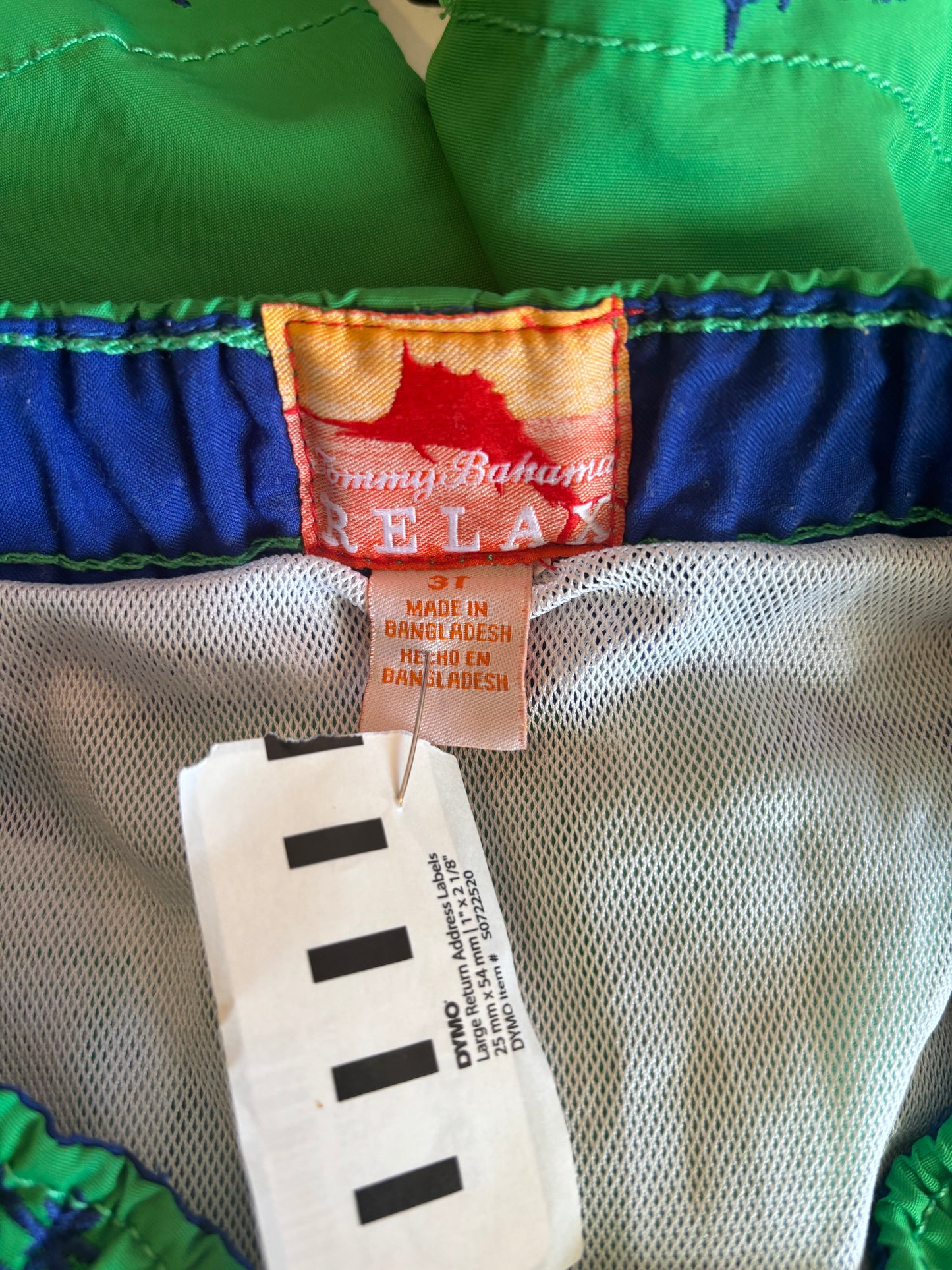 Tommy Bahama green swim trunks with blue palm trees. Size 3T.