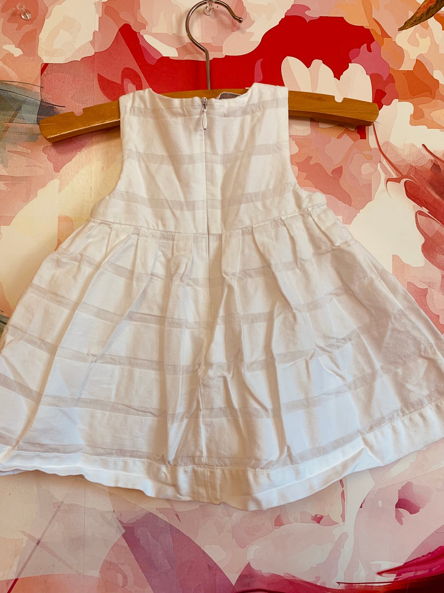 Ciccino white baby dress. Italian brand. 100% cotton. Pleats & tiny pink flowers on neck and front hem. Size 9m.