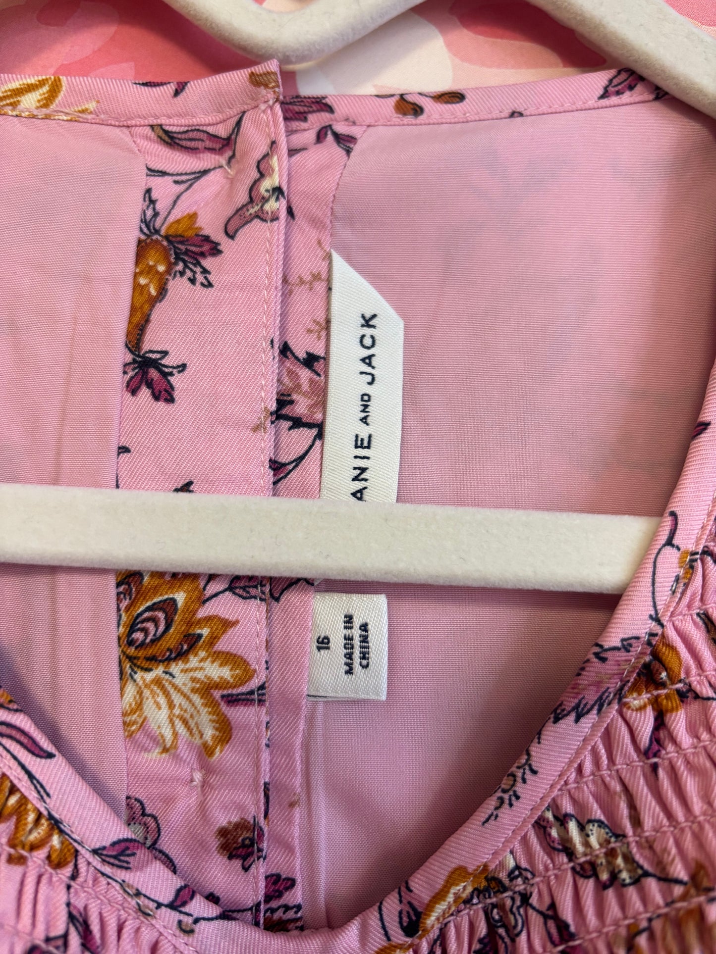 Janie & Jack pink smocked dress with flowers. Button closures on back. Size 16.