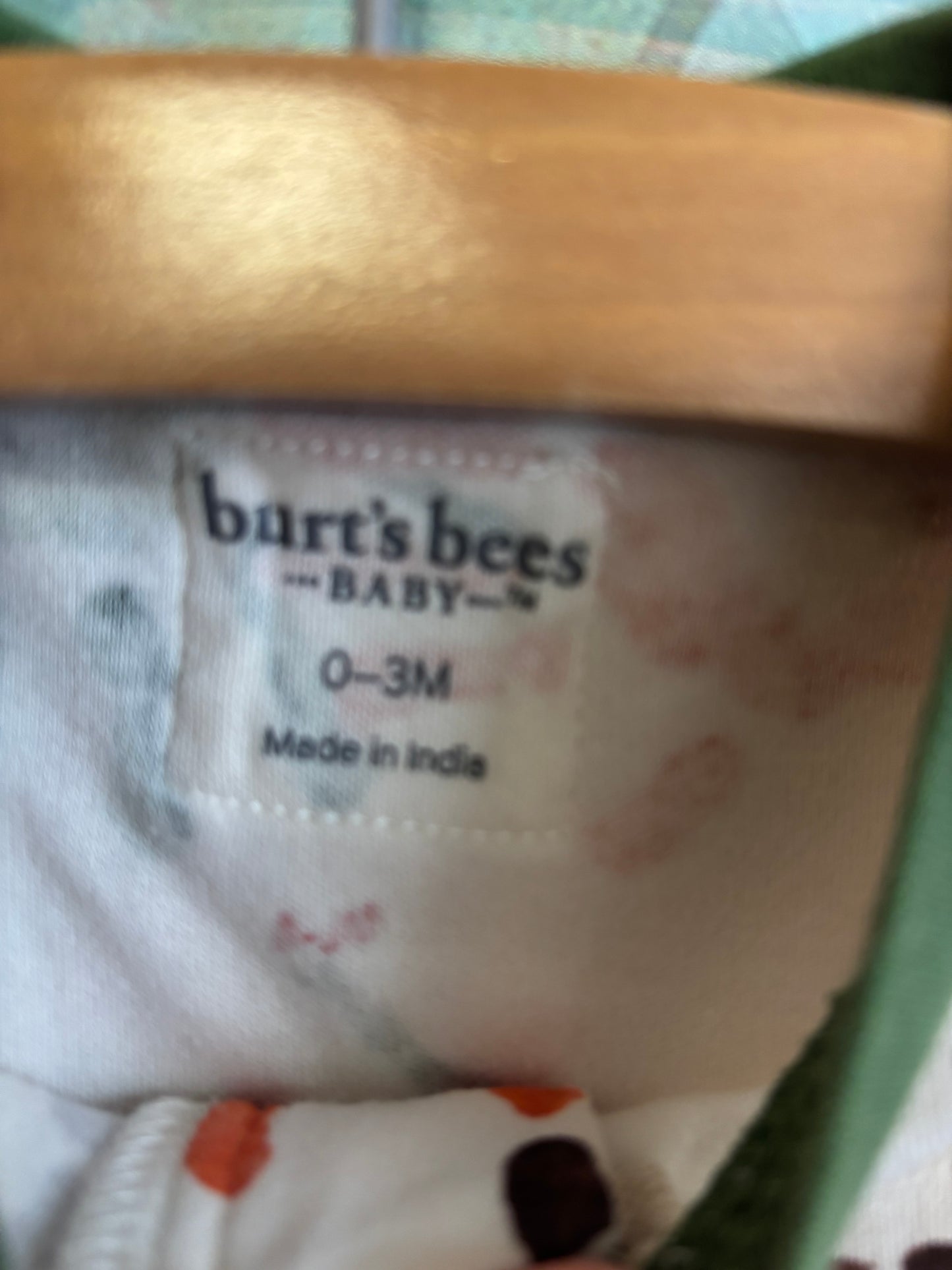 Burt’s Bees cream long sleeve romper with brown, green, orange handprint turkeys. Size 0-3m / NB