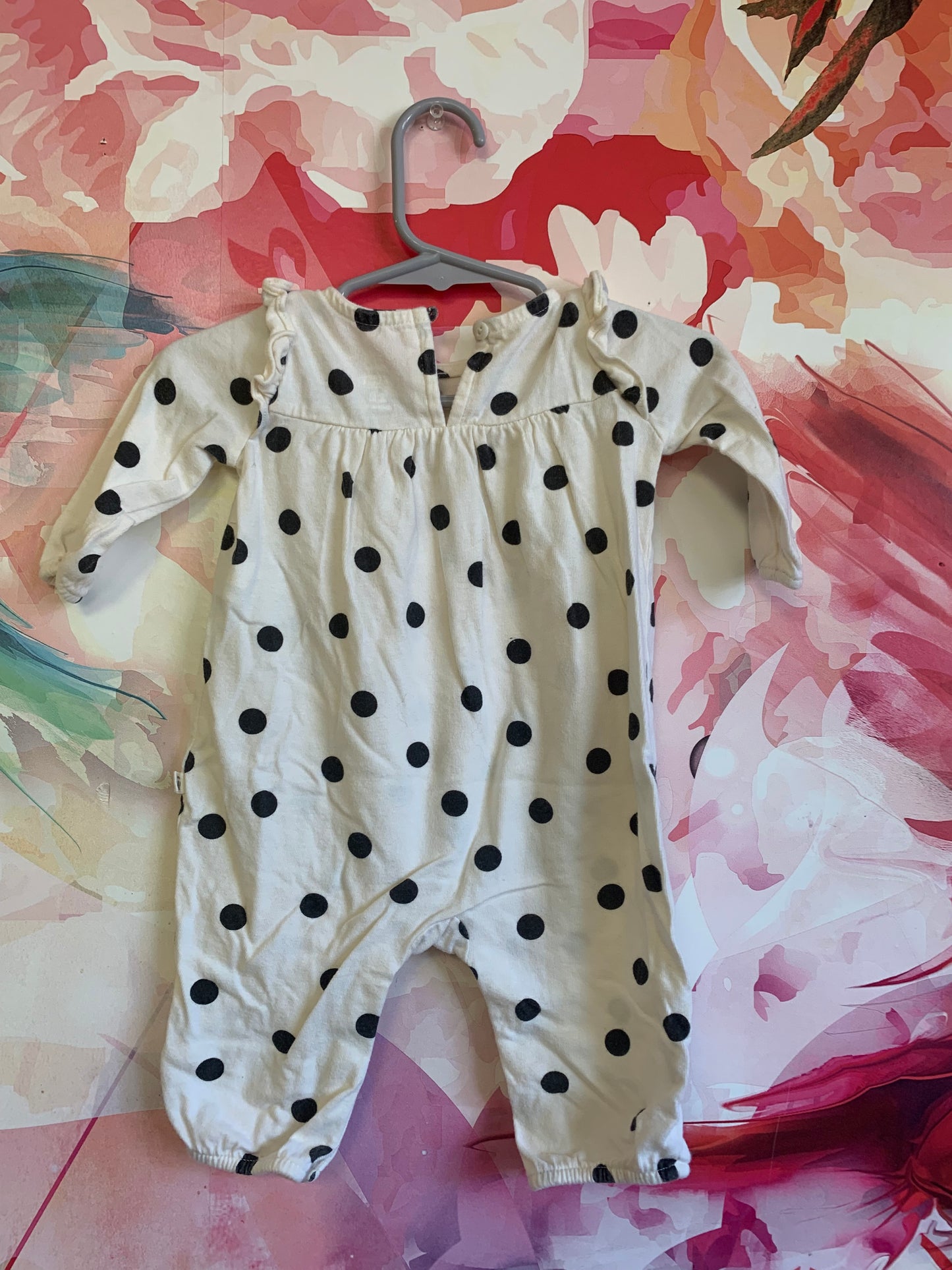 Baby Gap cream long sleeve romper with black polka dots. Snap closures. Size 0-3m / NB