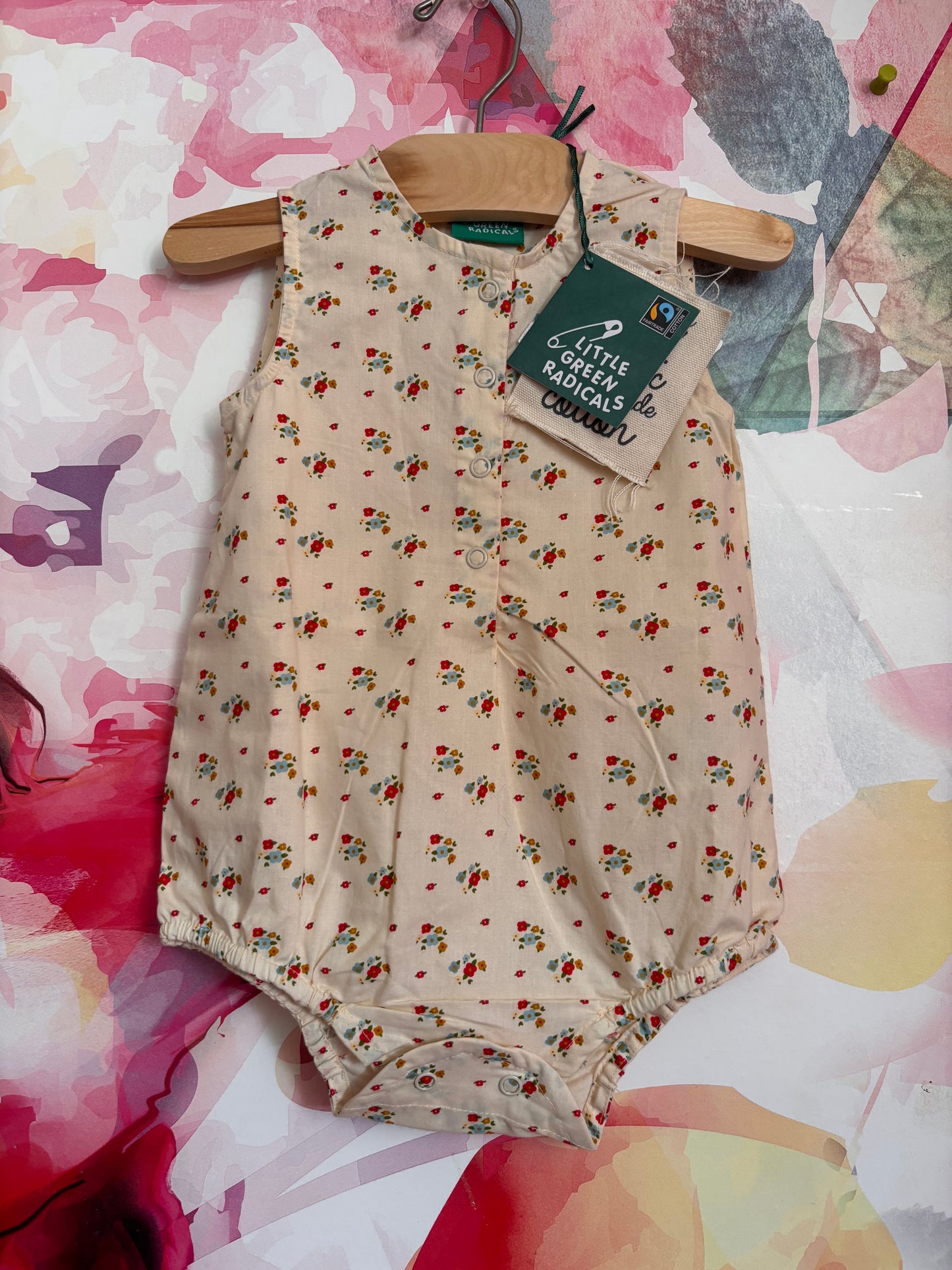 Little Green Radicals cream romper with tiny blue & red & gold flowers. Size 12-18m. NEW WITH TAGS