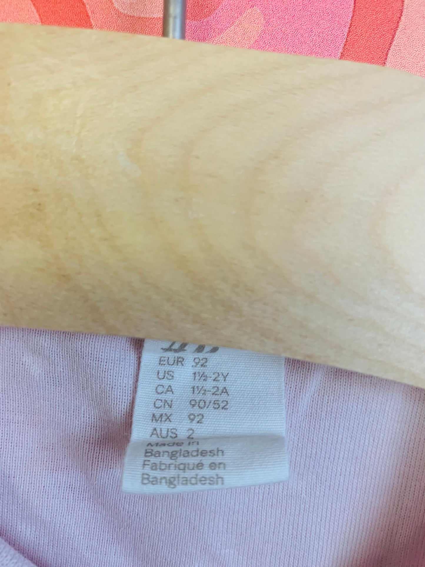 H&M pale pink onesie with tiny white hearts. Size 18-24m