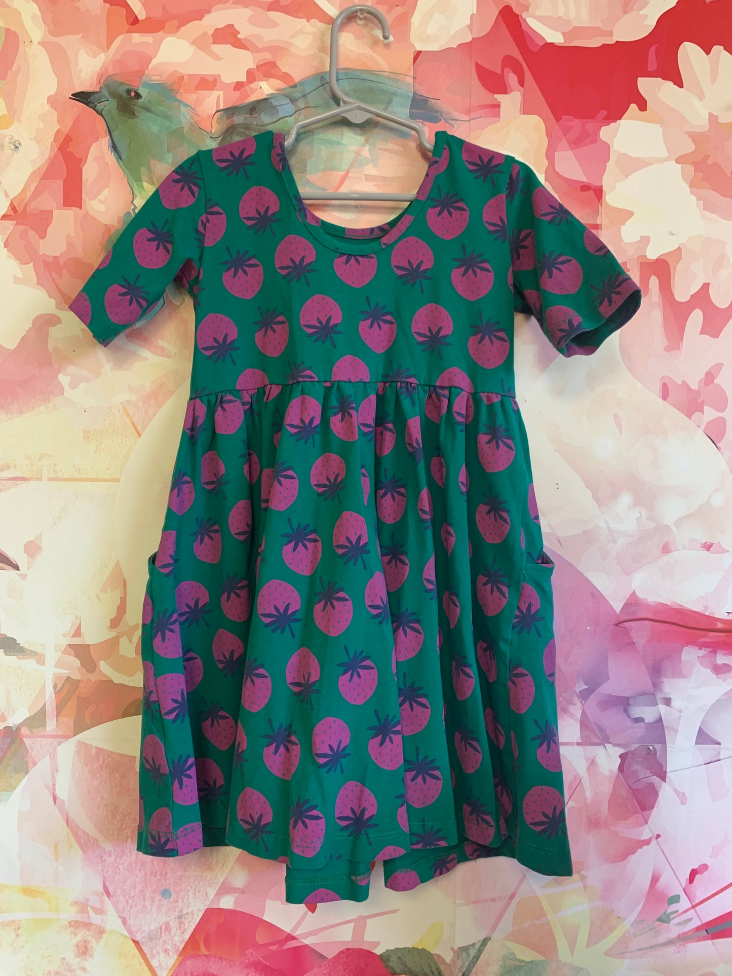 Hanna Andersson green short sleeve dress with purple strawberries. Side pockets. Scoop neck. Size 5T