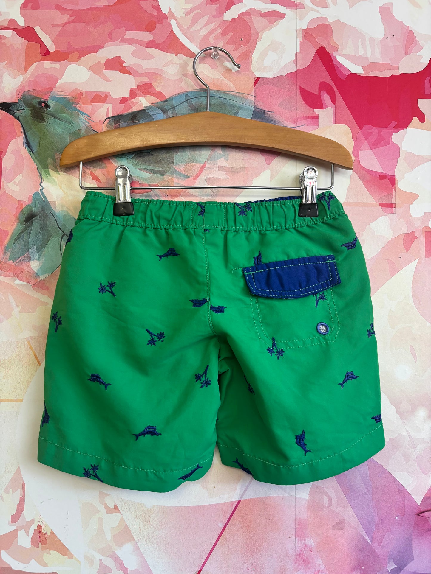 Tommy Bahama green swim trunks with blue palm trees. Size 3T.