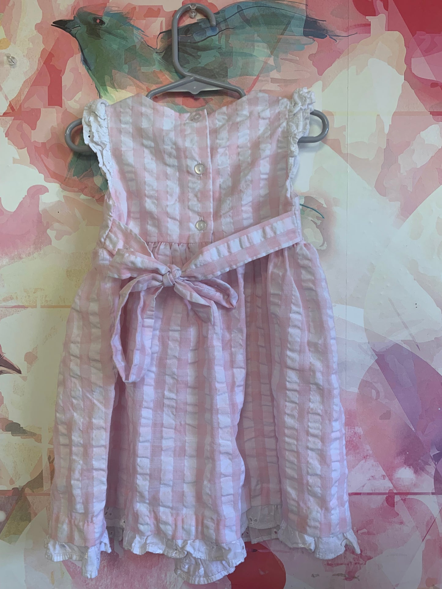 Bonnie Baby pink & white checkered sleeveless dress with Lacey trim on shoulders & hem. Tiny pink flowers, buttons & waist bow in back. Size 24m