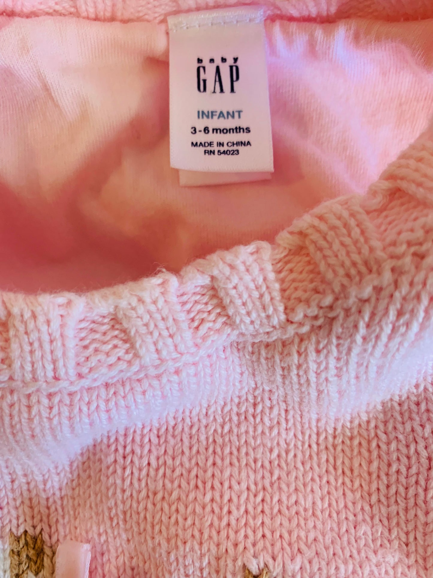 Baby Gap knit pink vest with brown/white dog in pink bow. Size 3-6m