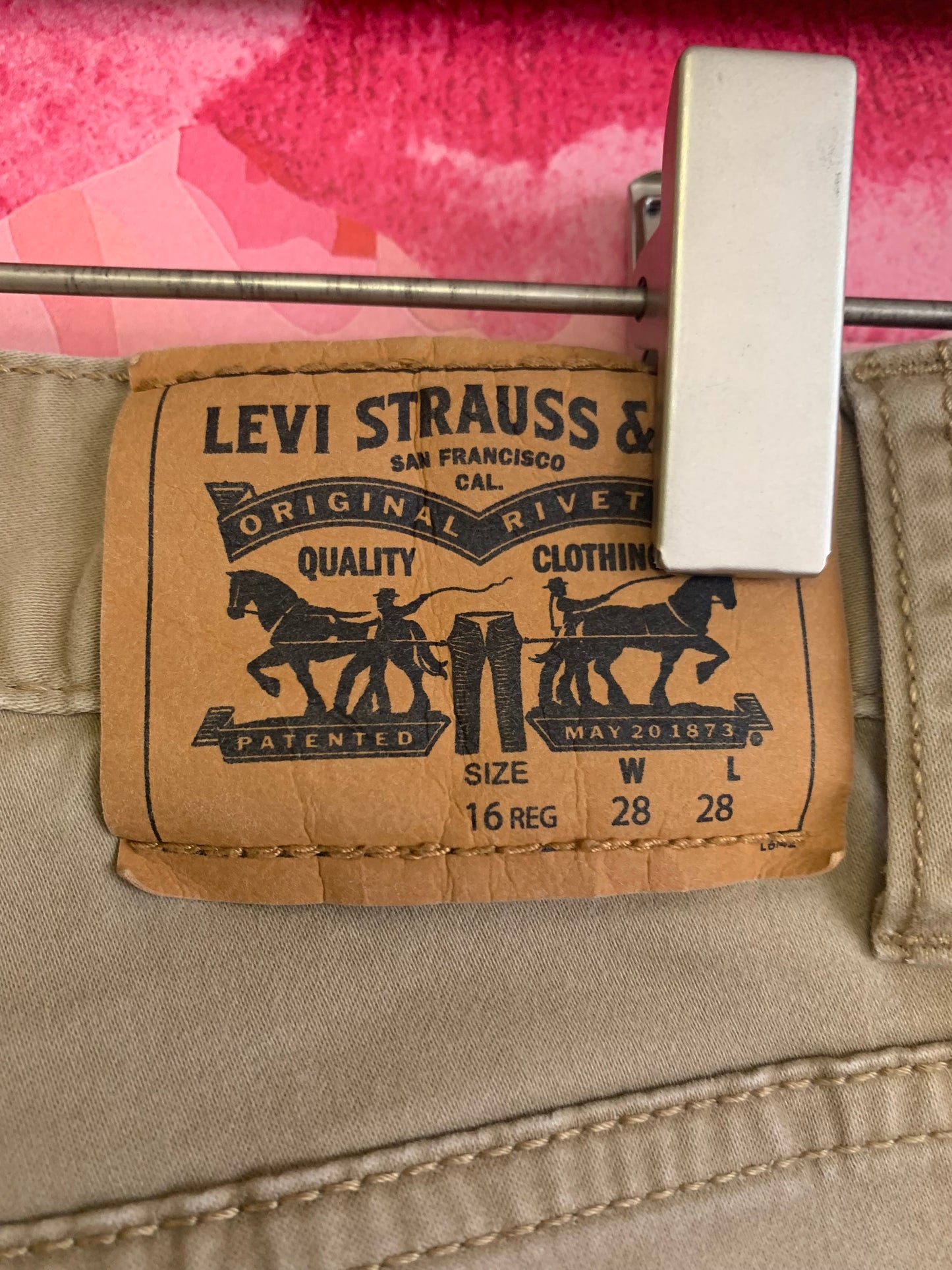 Levi’s slim fit khaki pants. Tiny stain on back left leg. See photo. Size 16.