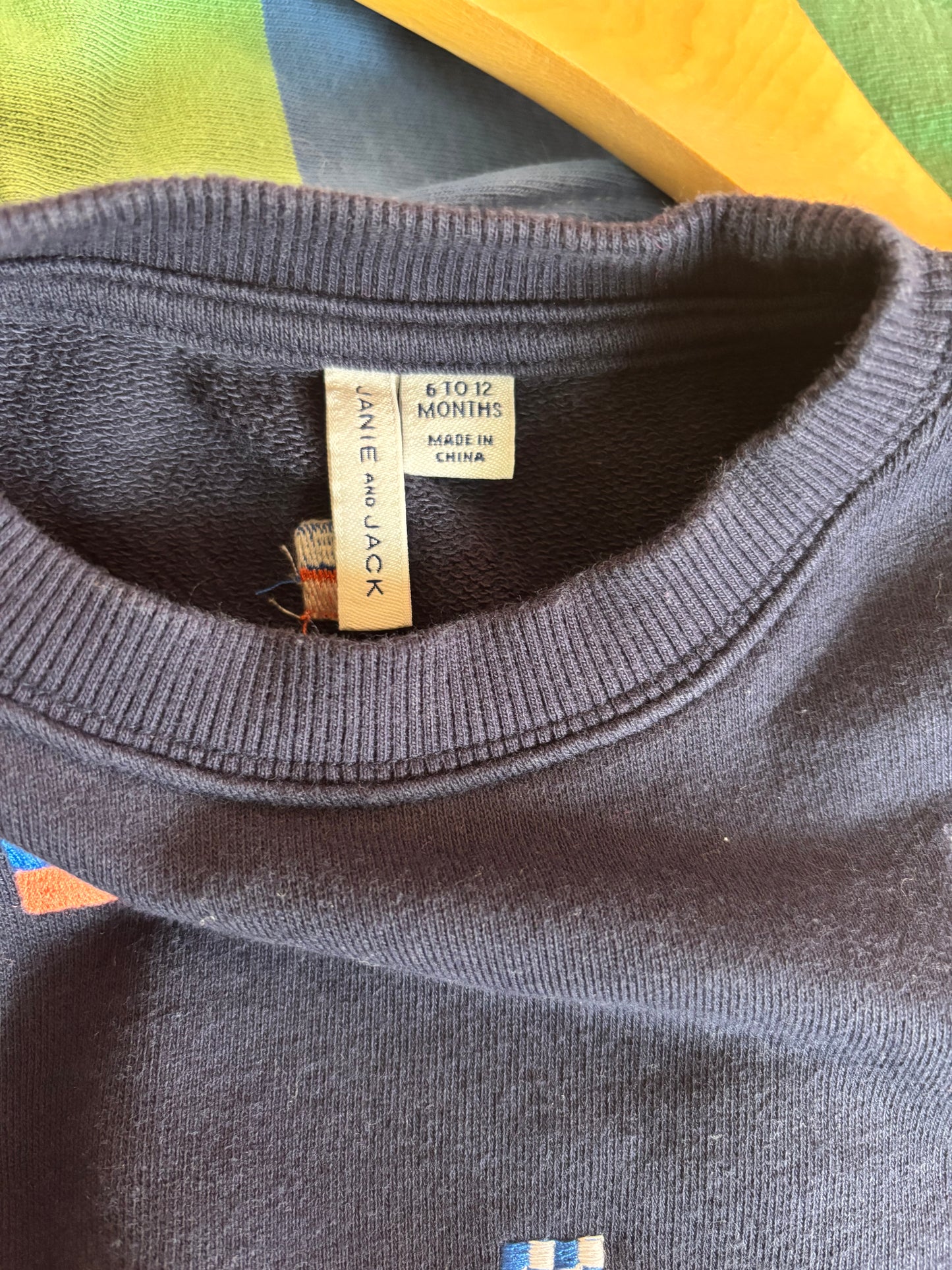 Janie & Jack navy blue sweatshirt with tiny flags. Size 6-12m.