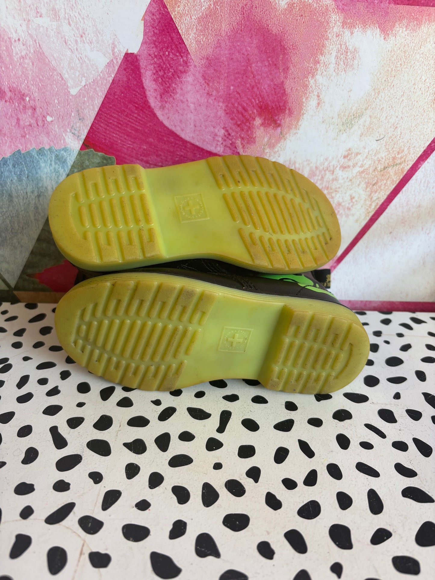 Doc Martens black leather boots with glow in the dark neon green skeleton foot bones. Size 10L.