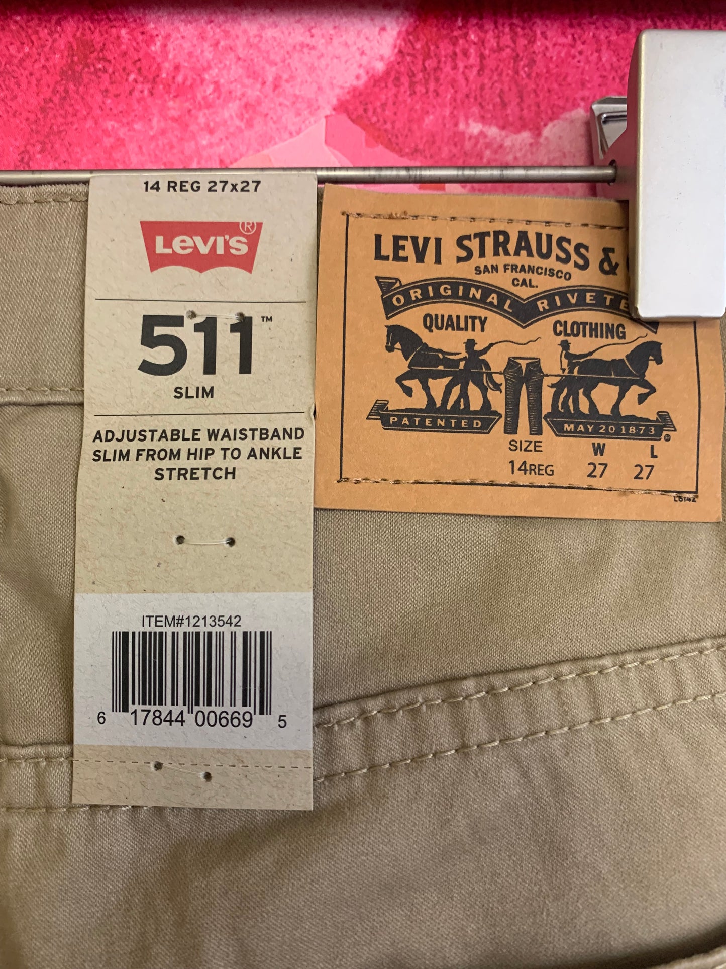 Levi’s khaki pants. *New with Tags*. adjustable waistband slim from hip to ankle with stretch. Size 14