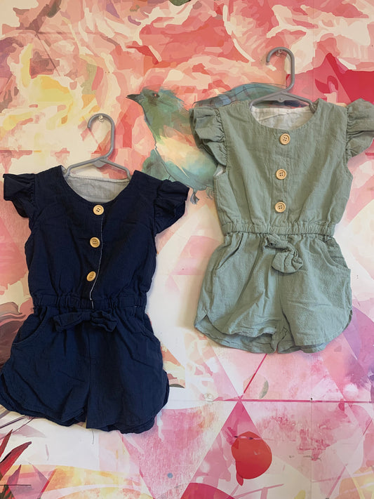 Blue and Green short sleeve rompers with buttons down front & front pockets. Size 4T.