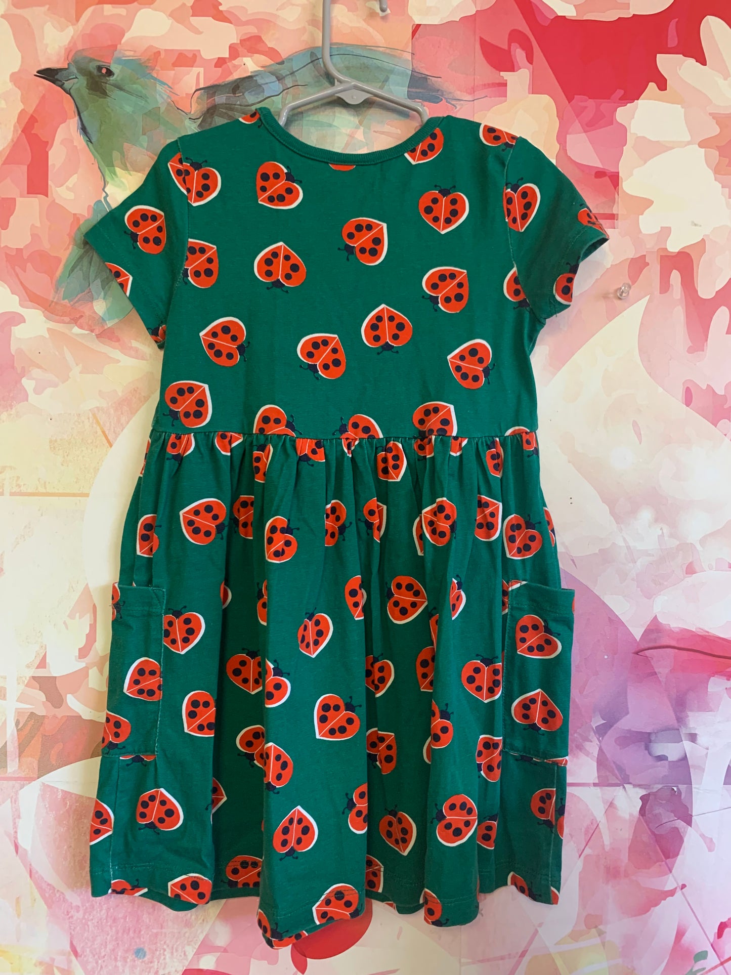 Hanna Andersson green short sleeve dress with red heart shaped ladybugs. Front pockets. Size 5T