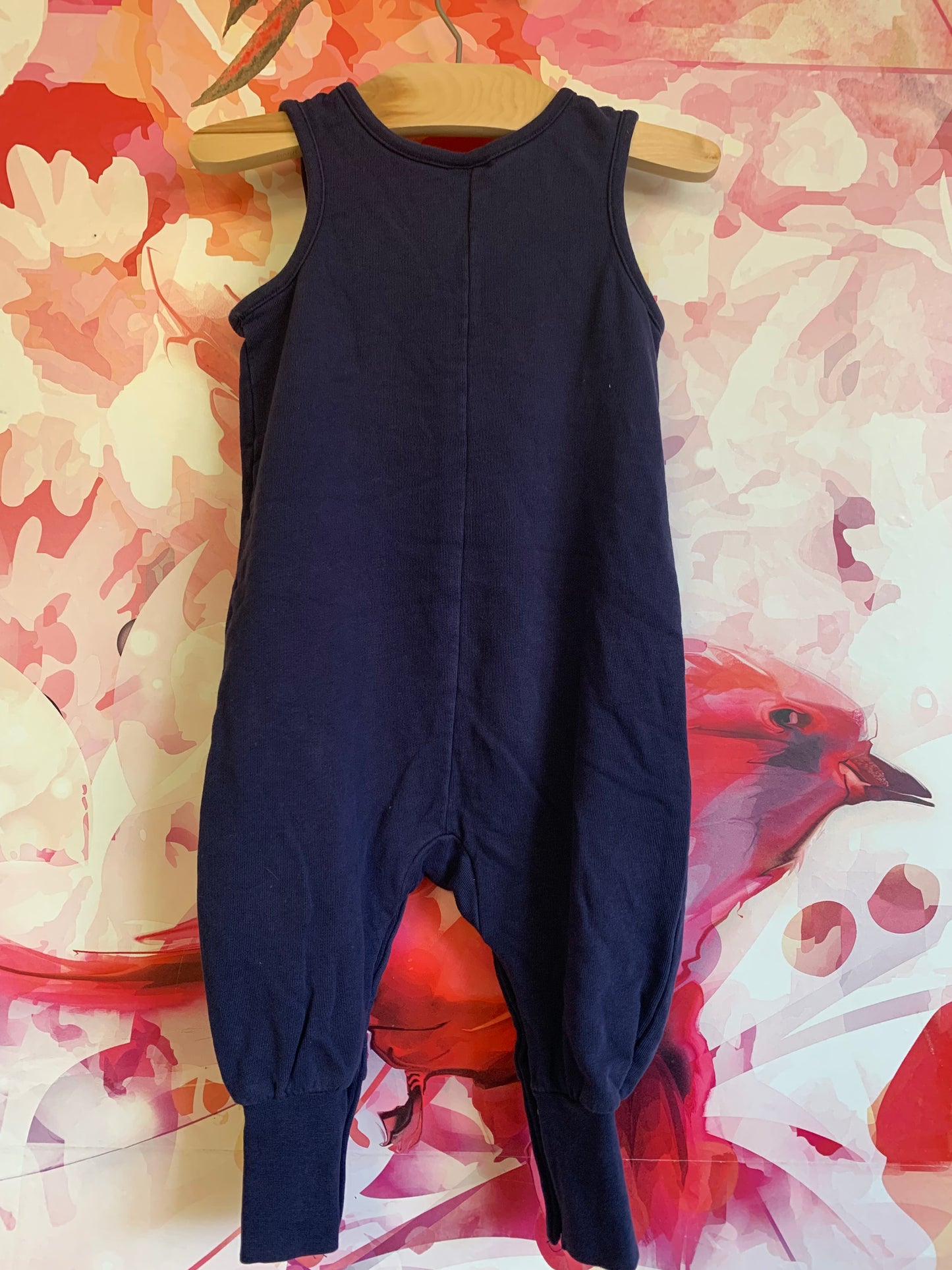 Hanna Andersson navy blue sleeveless romper. Button shoulders and ankle snaps. Size 18-24m