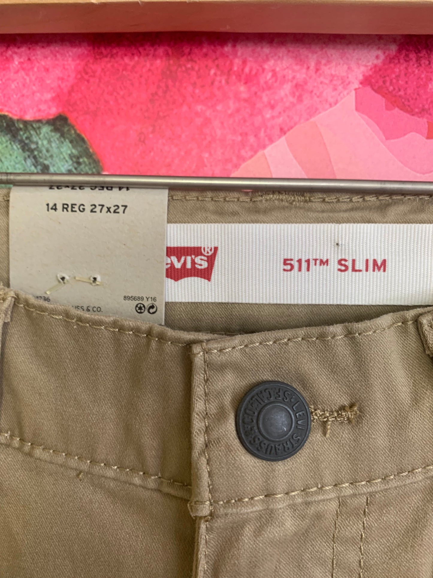 Levi’s khaki pants. *New with Tags*. adjustable waistband slim from hip to ankle with stretch. Size 14