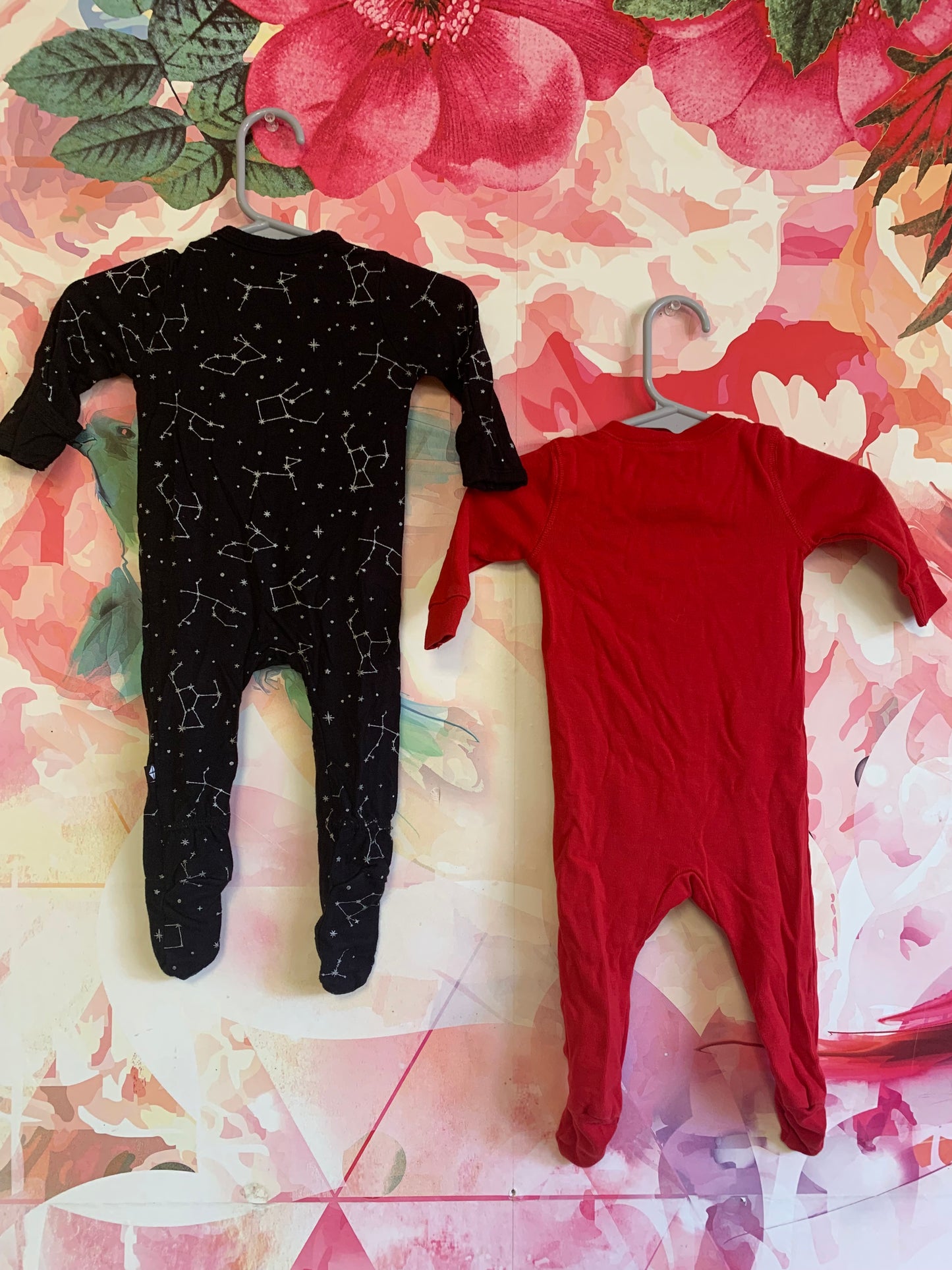 Kyte Black long sleeve romper with white constellations. Primary Red long sleeve romper. Size 0-3m / NB