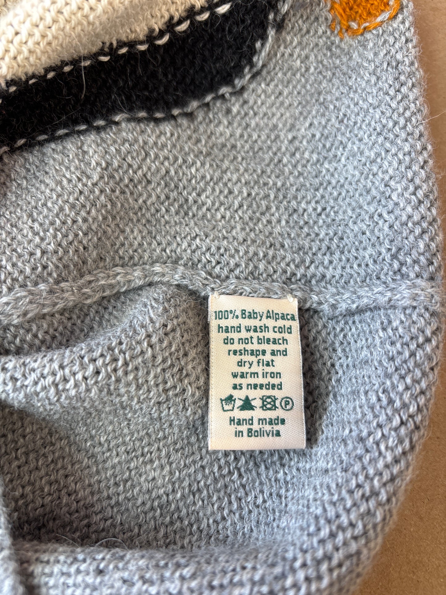 nanay grey 100% baby alpaca sweater with white/black penguin. Size 8T.
