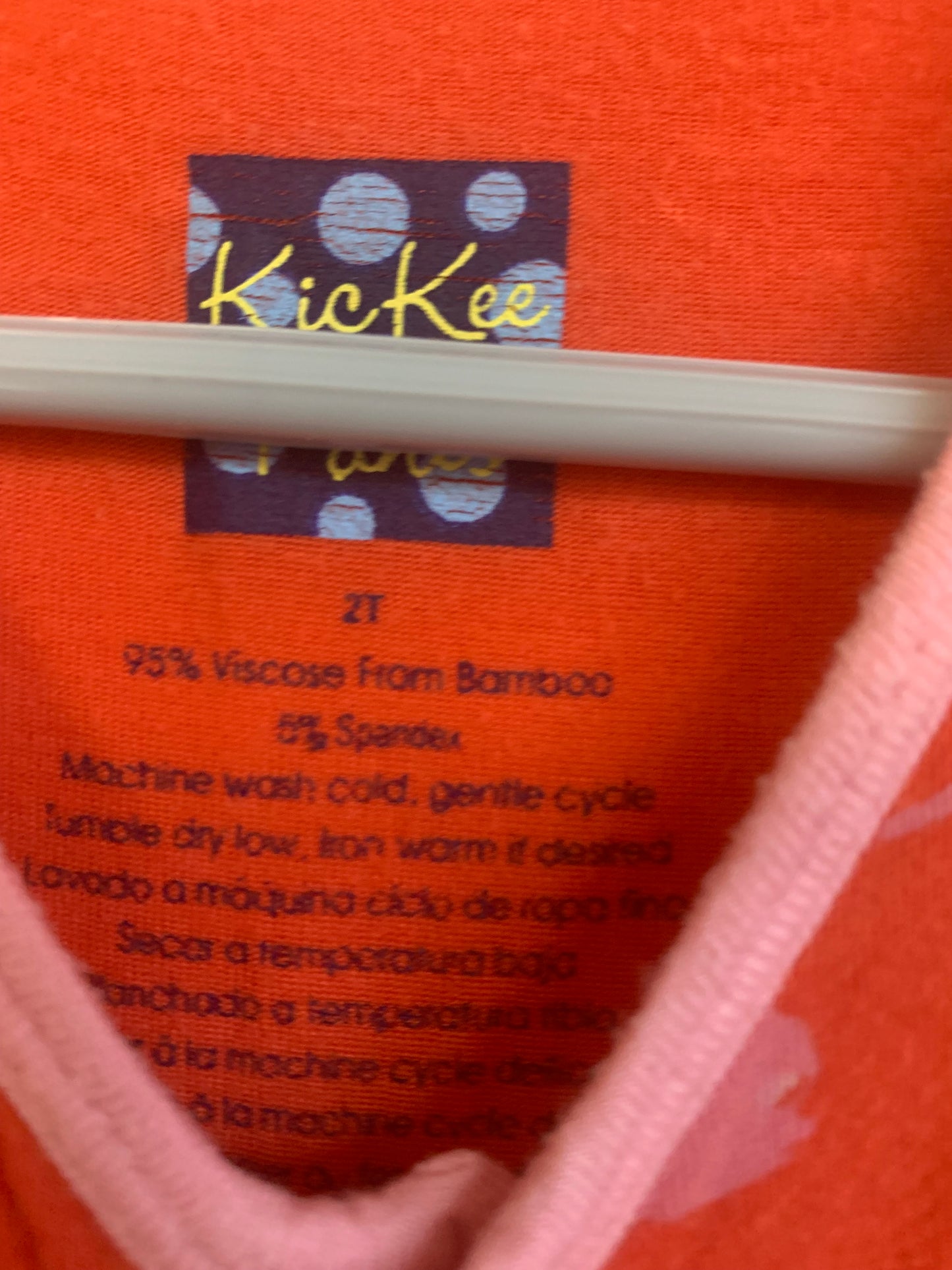 Kickee Pants short sleeve orange romper with pink otters & snaps. Made from bamboo. Size 2T