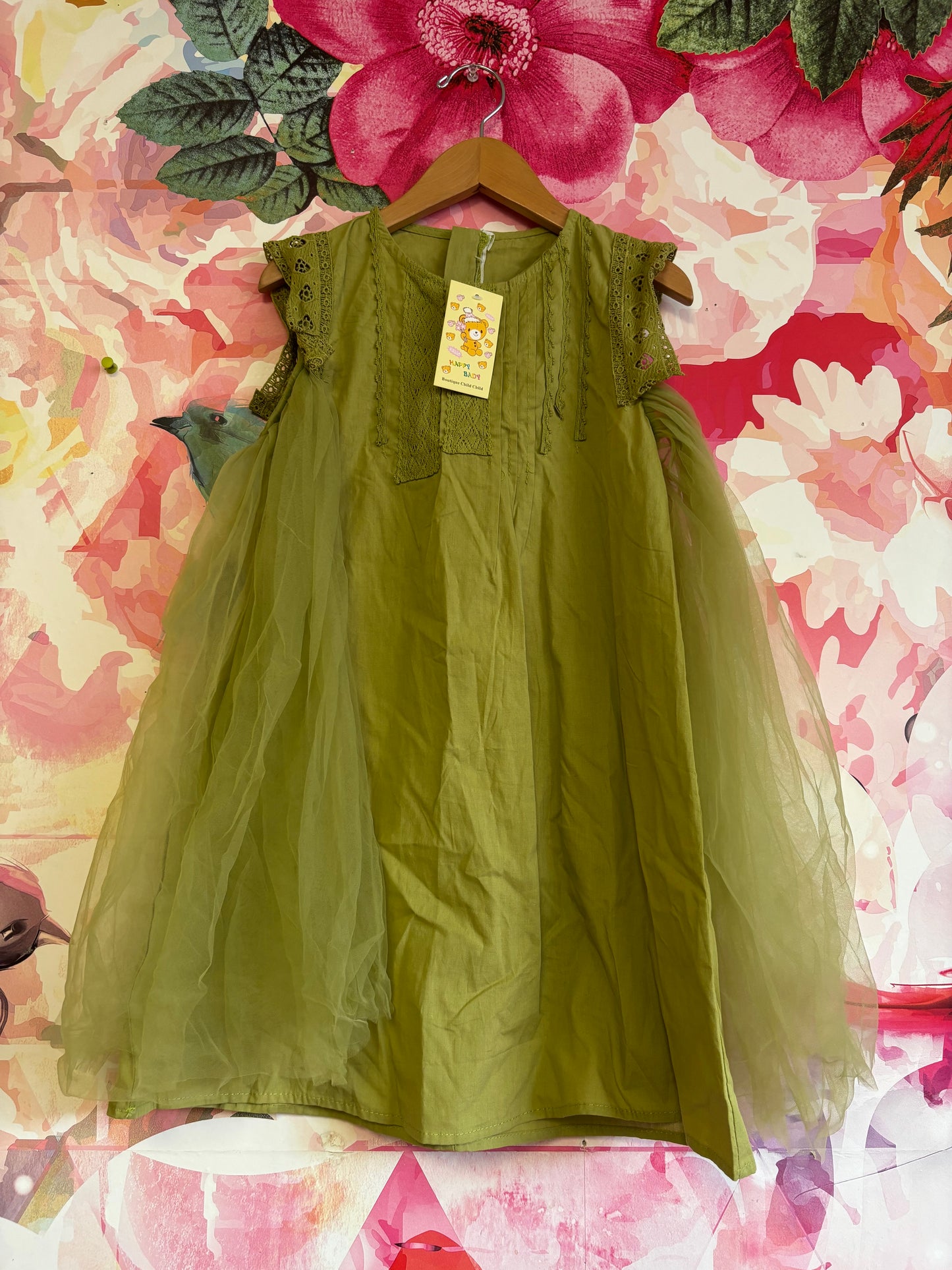 Boutique Child green dress with embroidered cap sleeves and tulle on sides. Zipper back. Size 5T / 6T