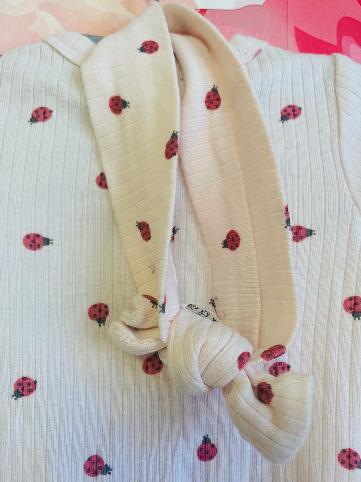 Rabbit & Bear long sleeve pink rubbed romper with small red ladybugs & matching headband. Size 0-3m / NB