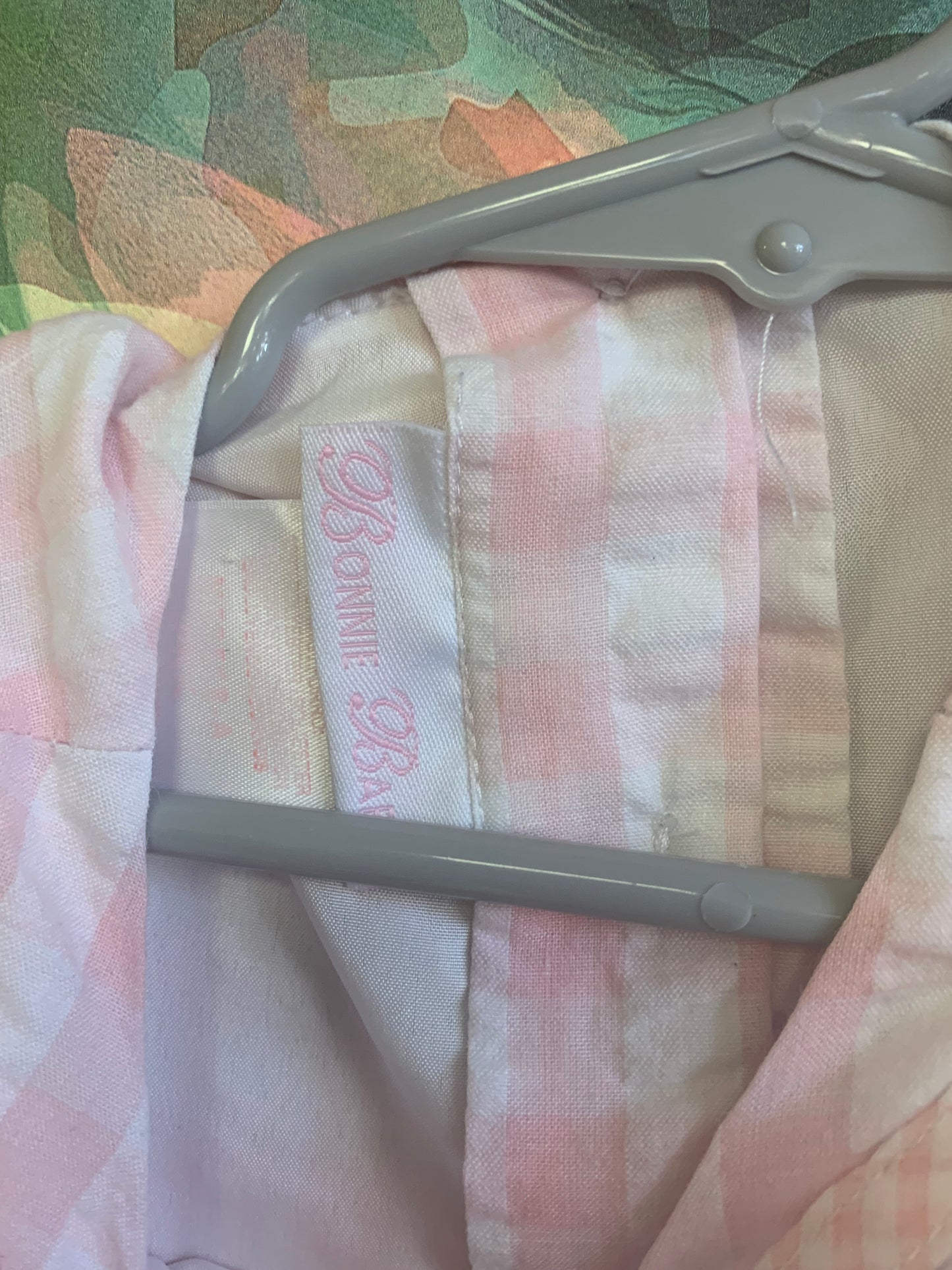 Bonnie Baby pink & white checkered sleeveless dress with Lacey trim on shoulders & hem. Tiny pink flowers, buttons & waist bow in back. Size 24m