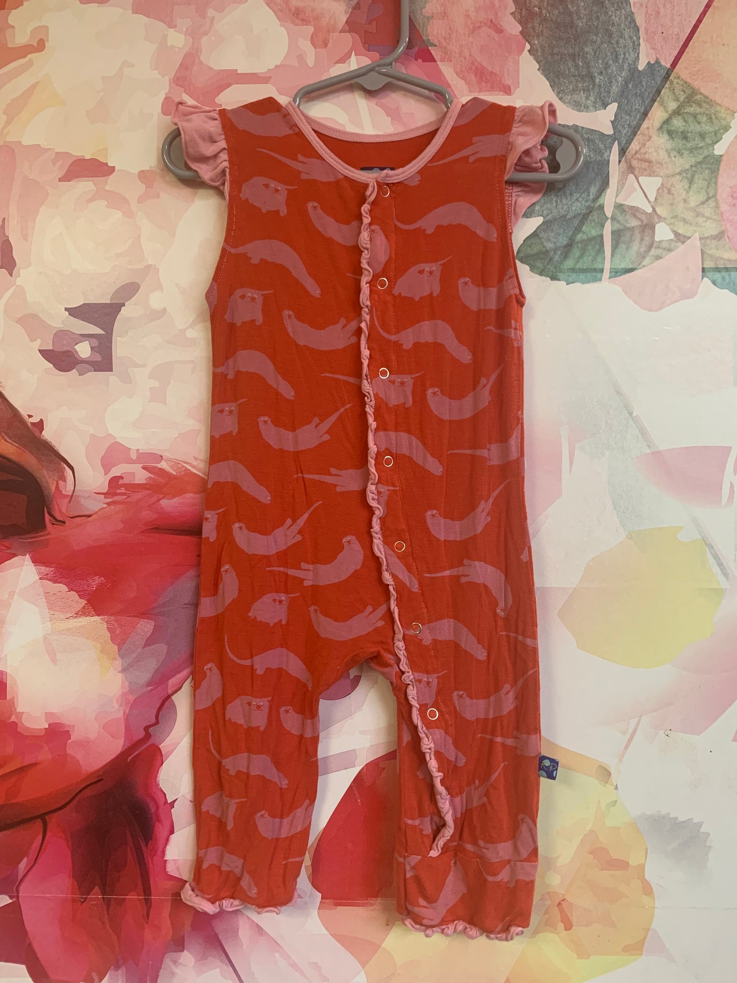 Kickee Pants short sleeve orange romper with pink otters & snaps. Made from bamboo. Size 2T
