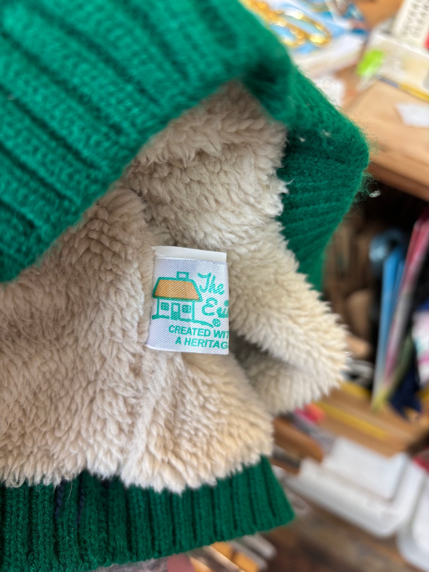 Fleece lined green knit sweater with hood. Size 24m