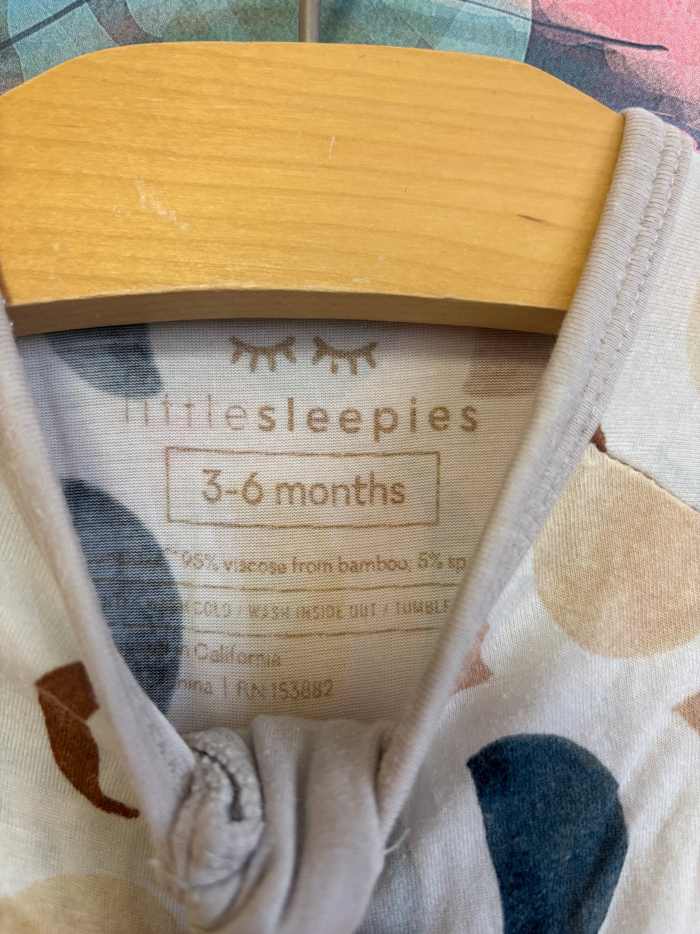 Little Sleepies cream romper with brown, blue, green moons. Fold over feet & hands. Size 3-6m
