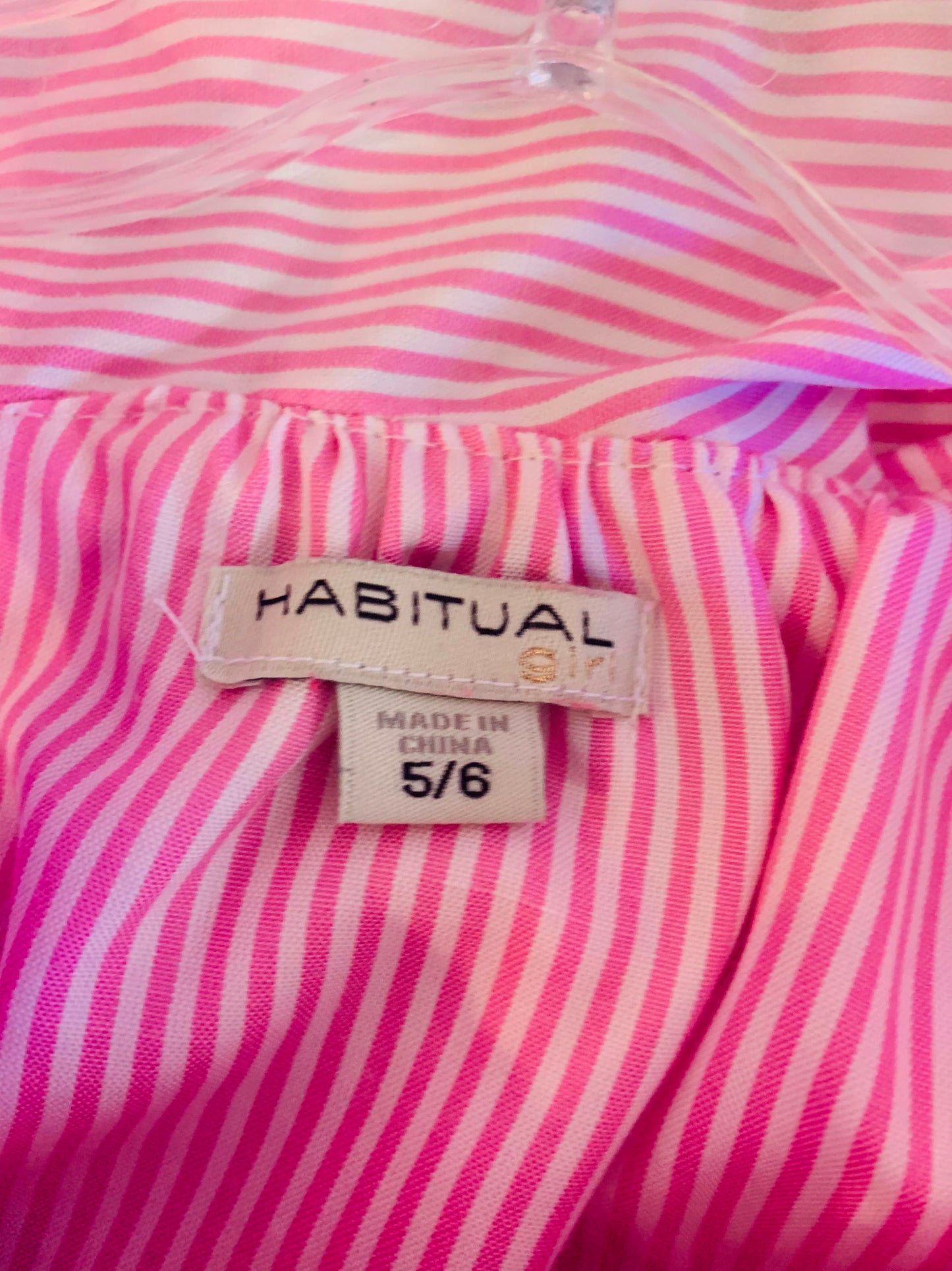 Habitual pink & white stripe romper with ruffle neckline and one shoulder strap. Waist tie. Size 5T / 6T