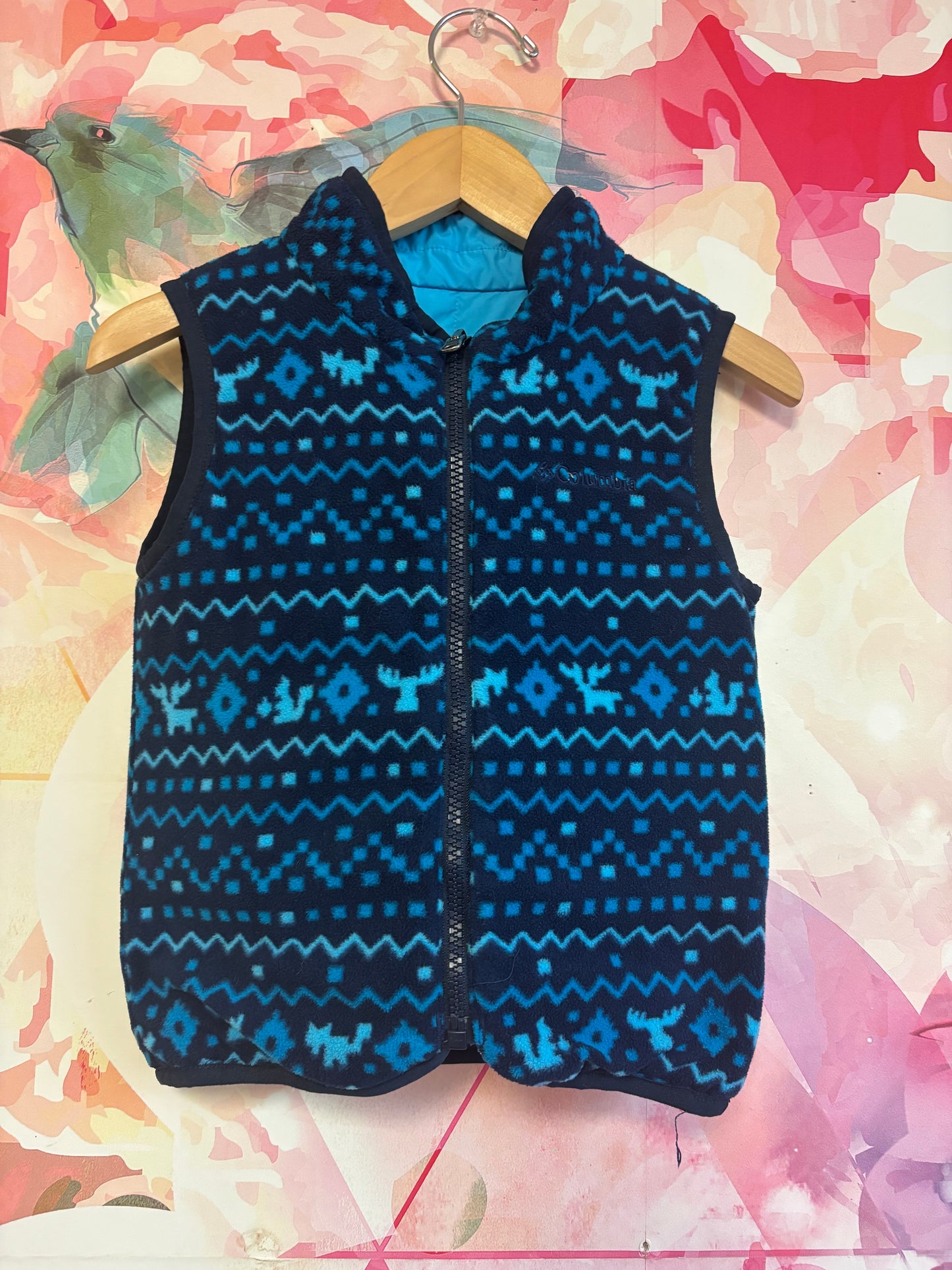 Columbia blue puffy vest with reversible fleece side. Size 4T