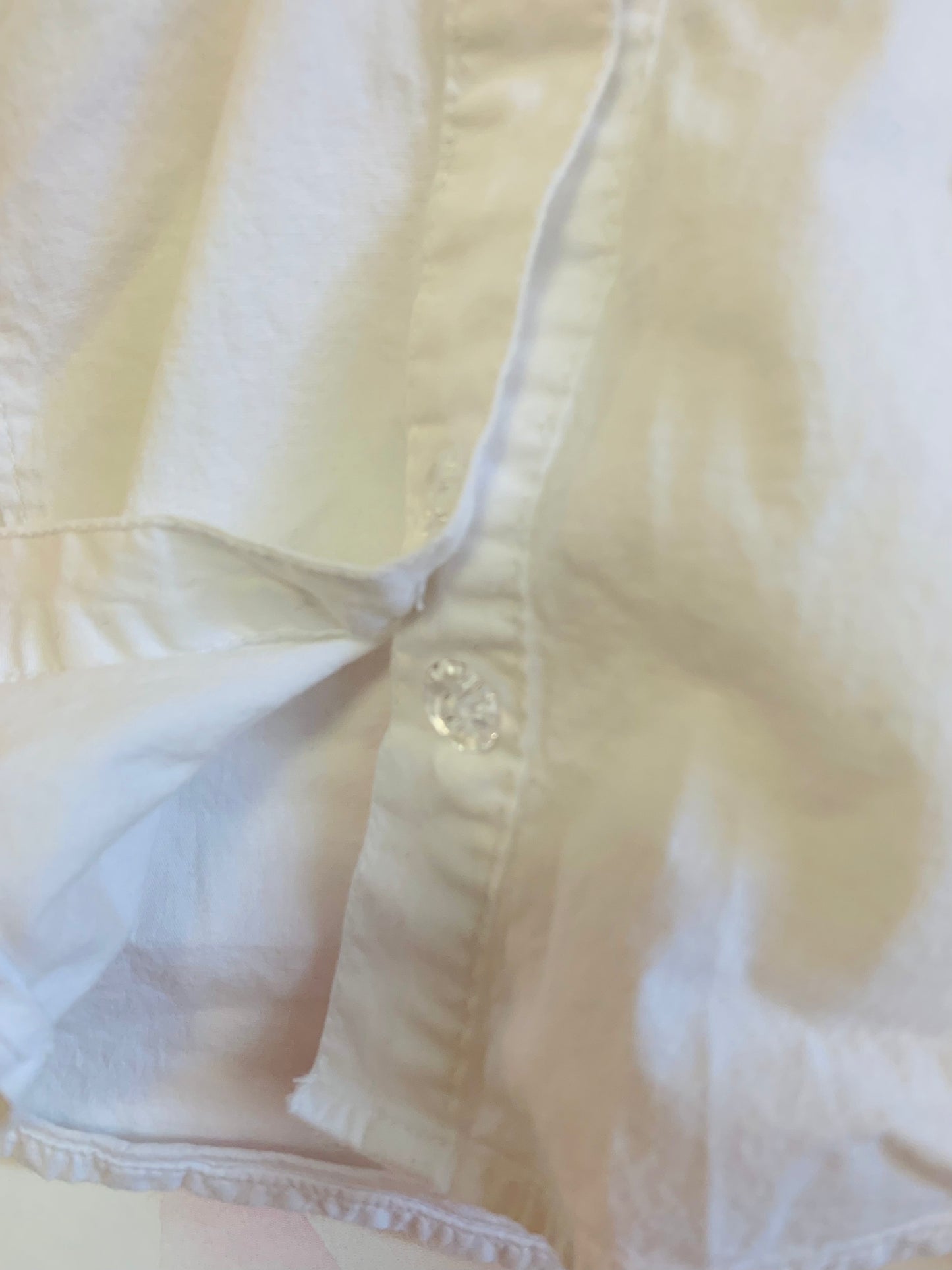 Armani Junior white button down cotton collared blouse with ruffle along clear buttons. Extra button attached - see pics. Size 8.
