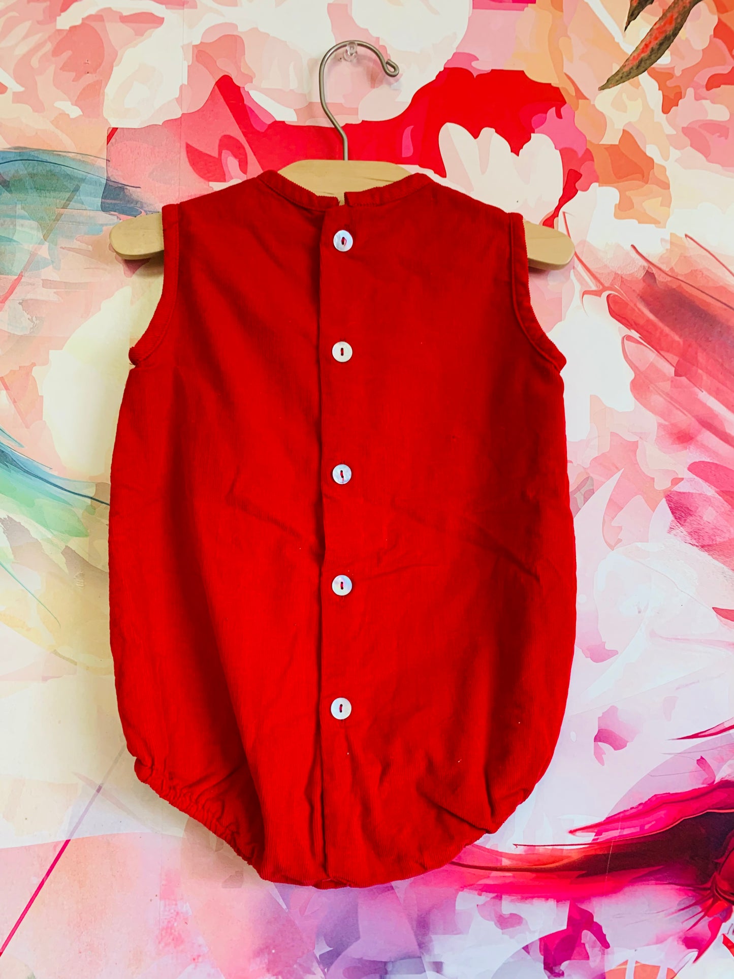 Os Estorninhos red corduroy sleeveless romper with buttons on back. Size 12-18m