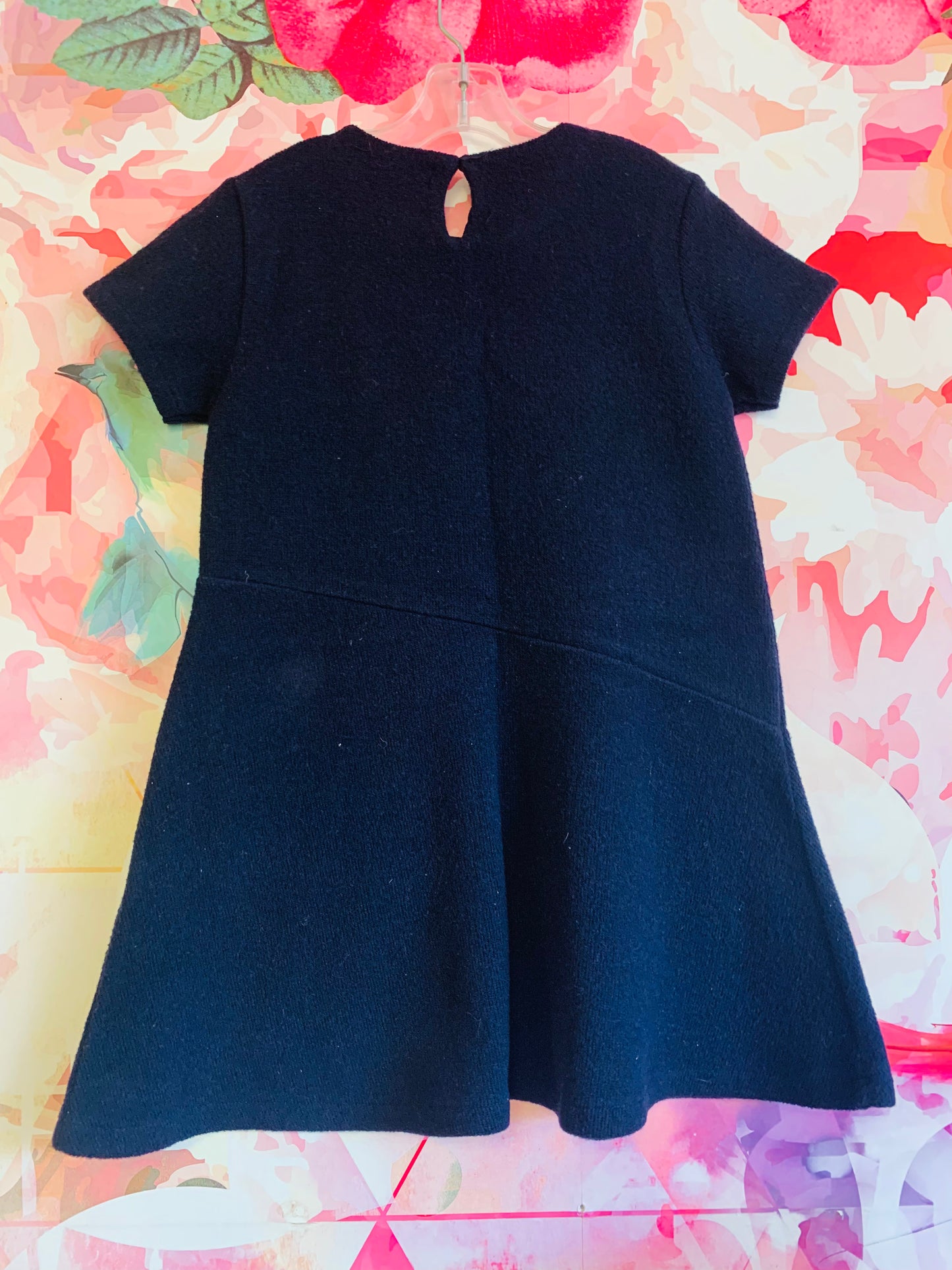 Zara navy blue sweater dress. Short sleeve with asymmetrical waist and embroidered flowers. Size 8T.