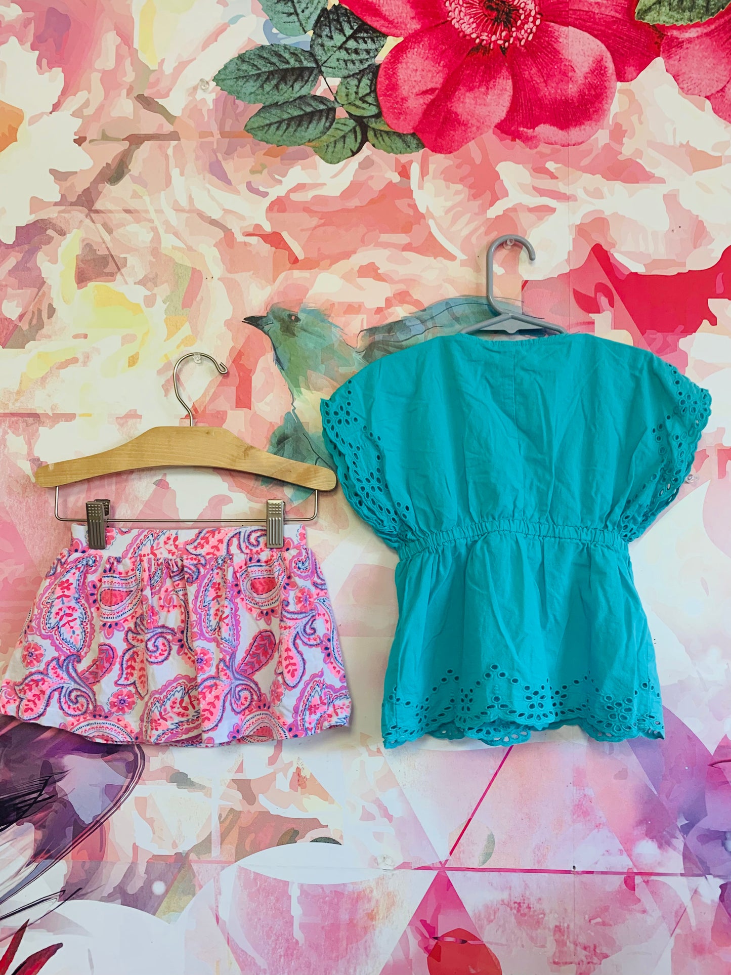 Janie & Jack green shirt sleeve top and Oshkosh pink, blue, white pattern skort. Size 2T.