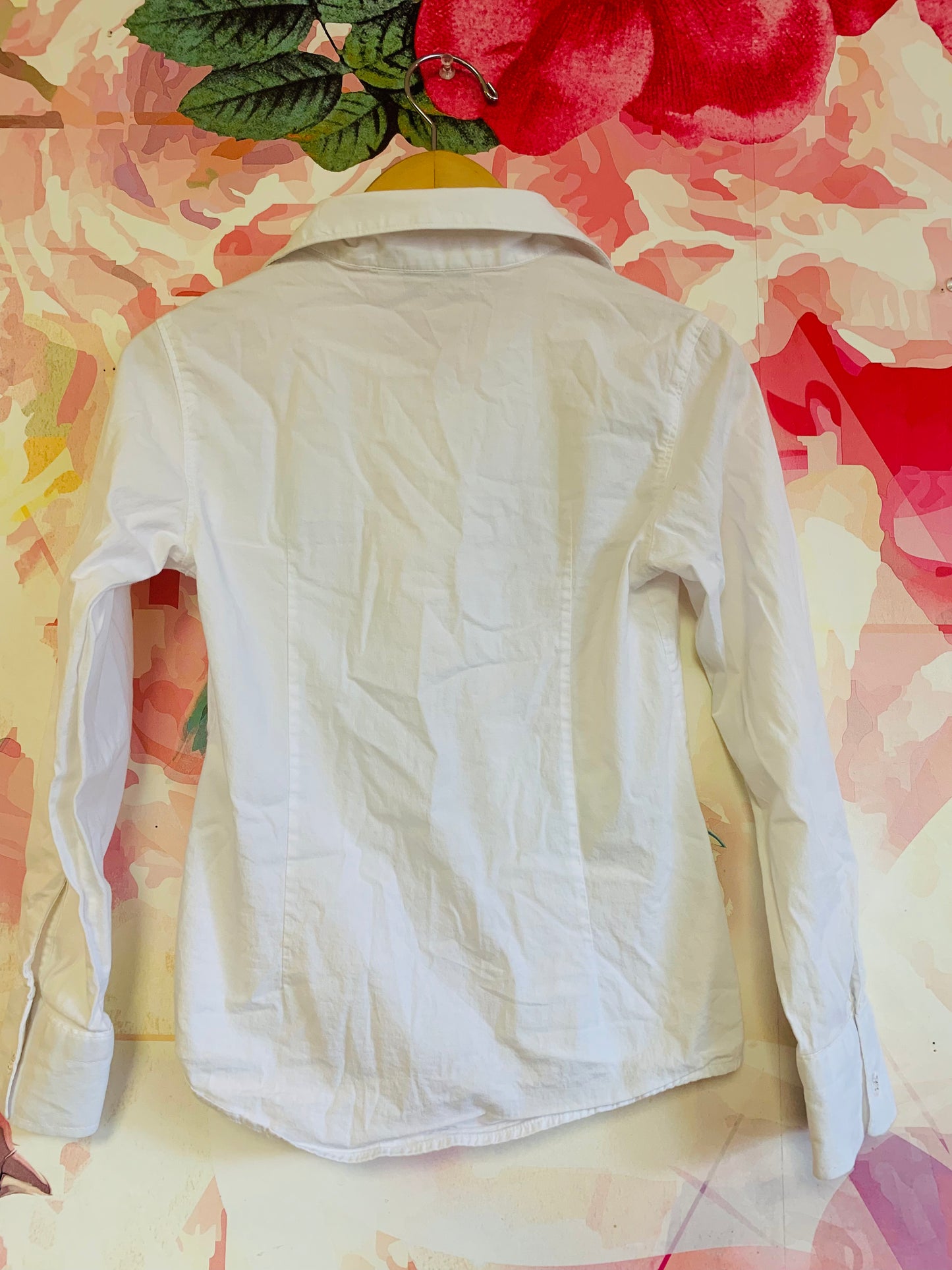 Armani Junior white button down cotton collared blouse with ruffle along clear buttons. Extra button attached - see pics. Size 8.