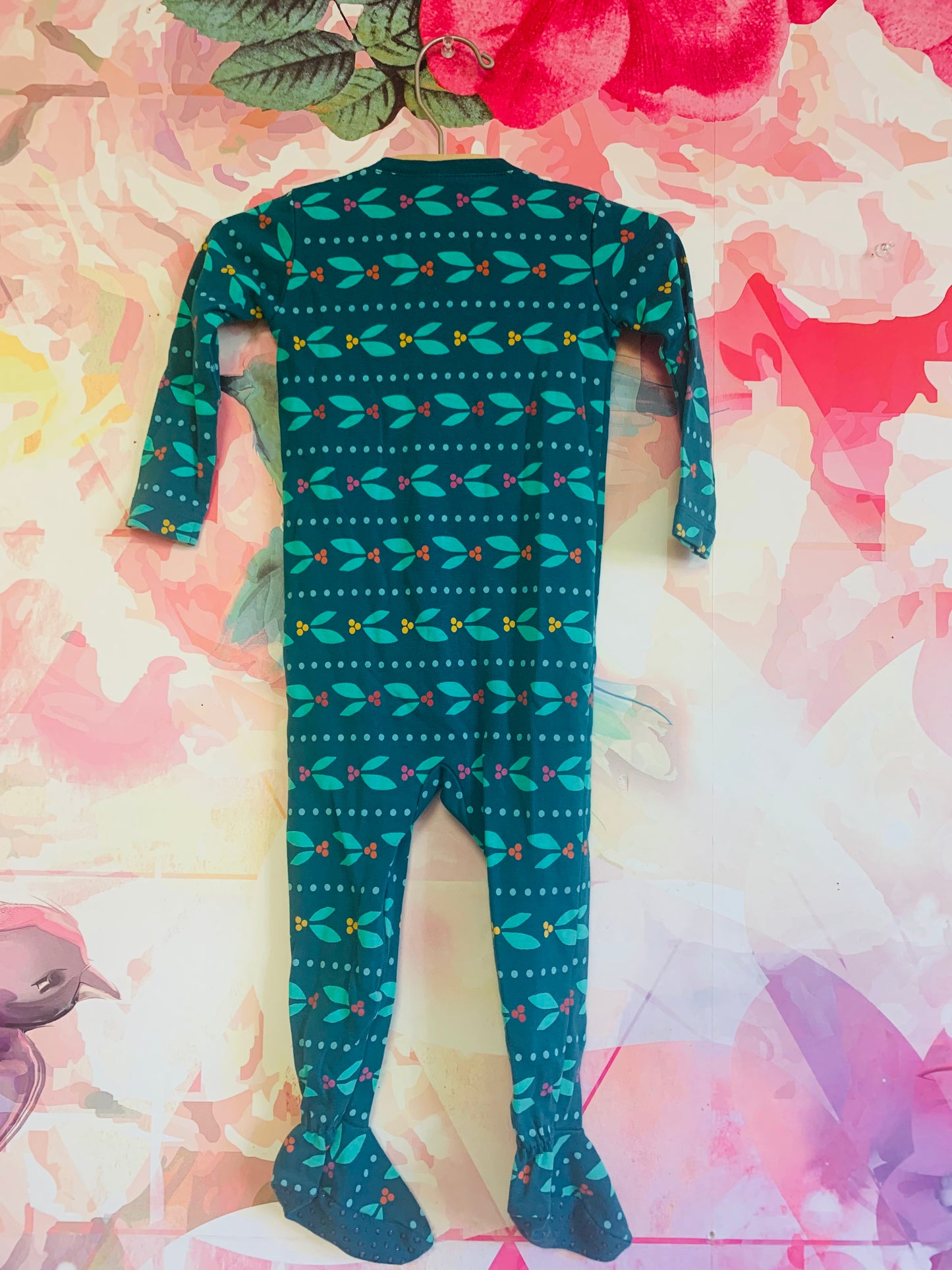 Primary green long sleeve footed romper with berry/leaf design. Grippers on bottoms of feet. Size 12-18m