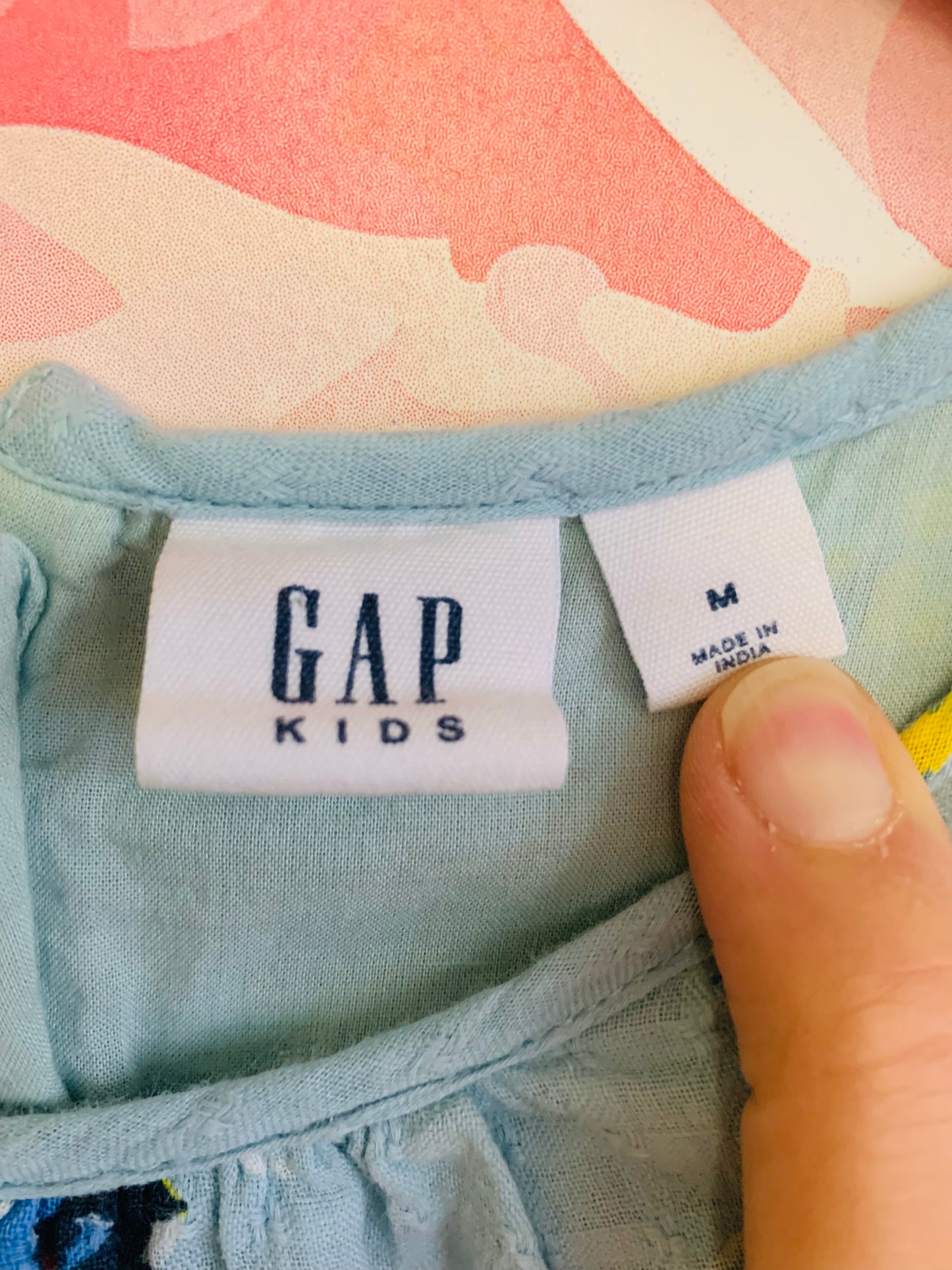 Gap light blue shirt sleeve dress with red, blue, yellow flowers. Size 8