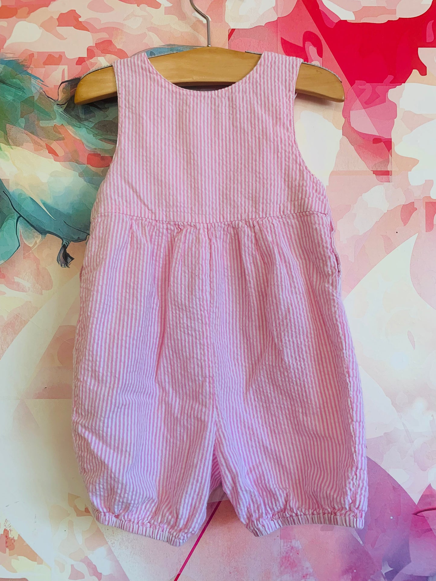 Jojo Maman Bébé sleeveless pink & white stripe romper. Two front pockets and buttons. Size 6-12m