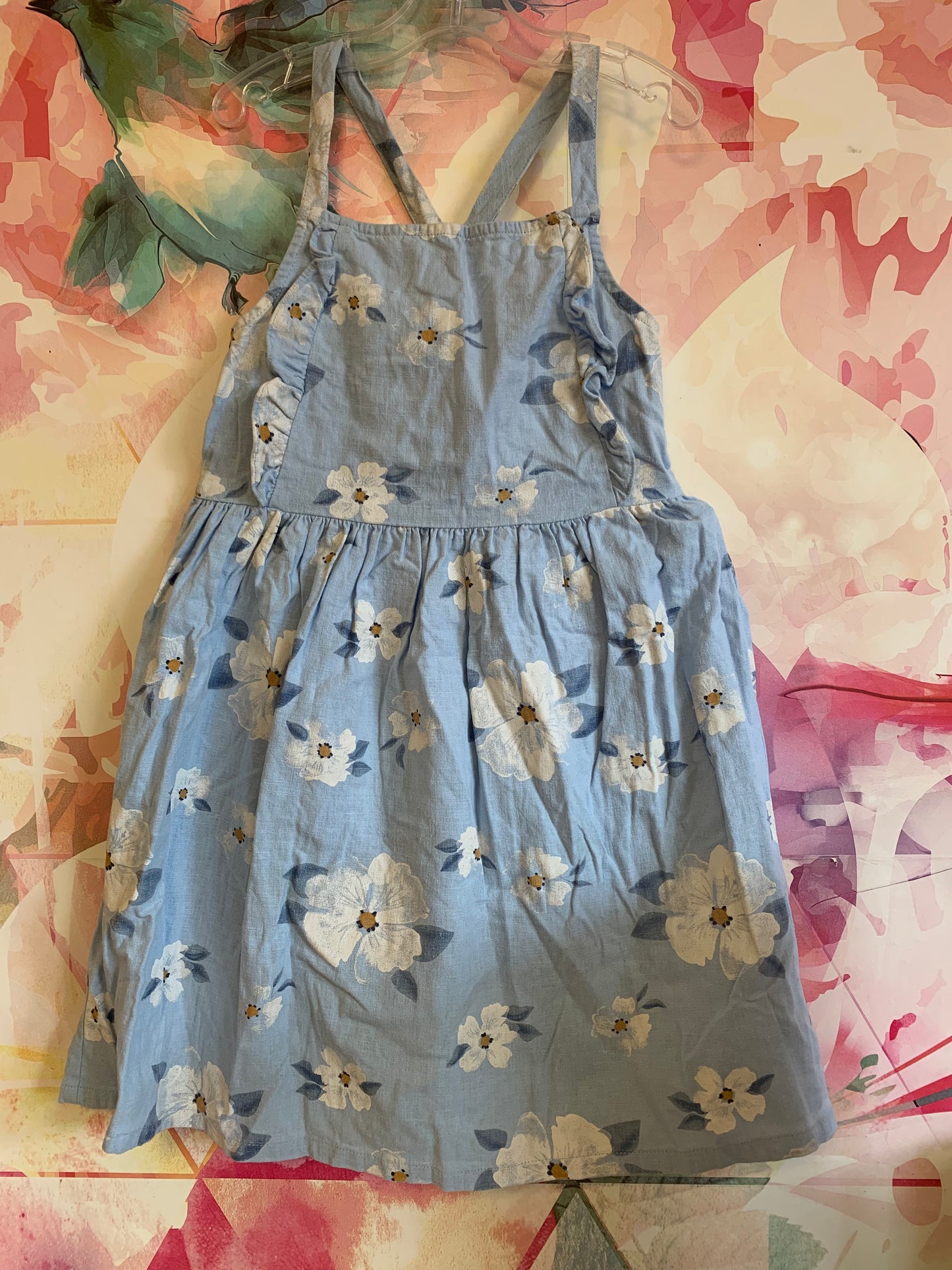 Carter’s blue dress with white flowers. Criss cross straps. Size 7T