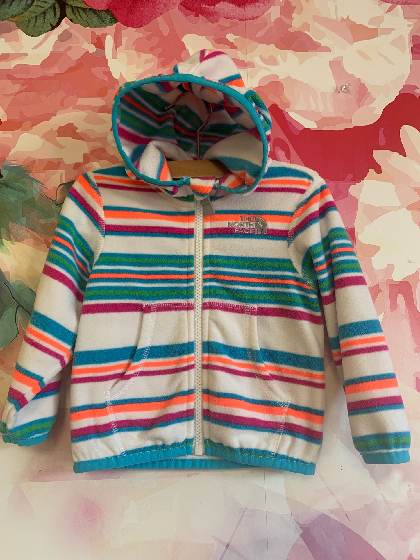 The North Face blue, purple, orange, green striped zip up fleece hoodie with pockets. Size 6-12m.