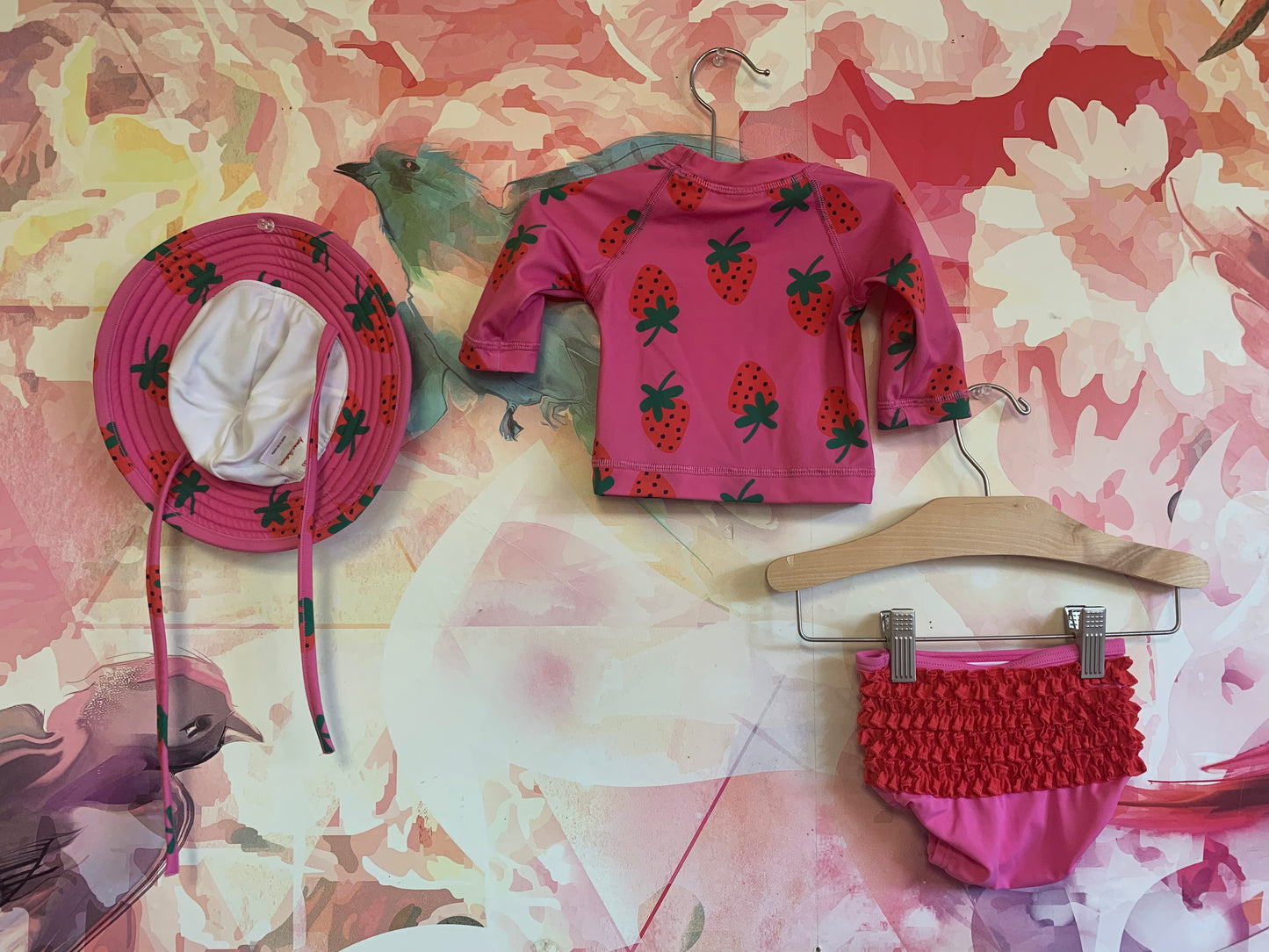 Hanna Andersson pink two piece swimsuit with red strawberries and matching hat. Size 0-3m / NB