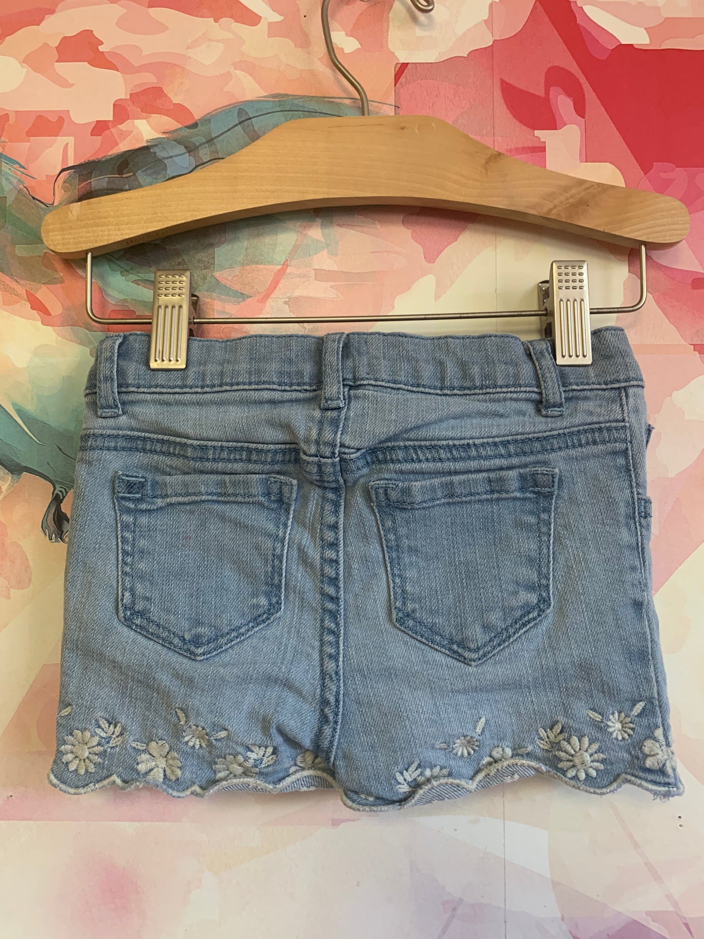 Baby Gap blue Jean shorts with white embroidery at hem. Size 12-18m