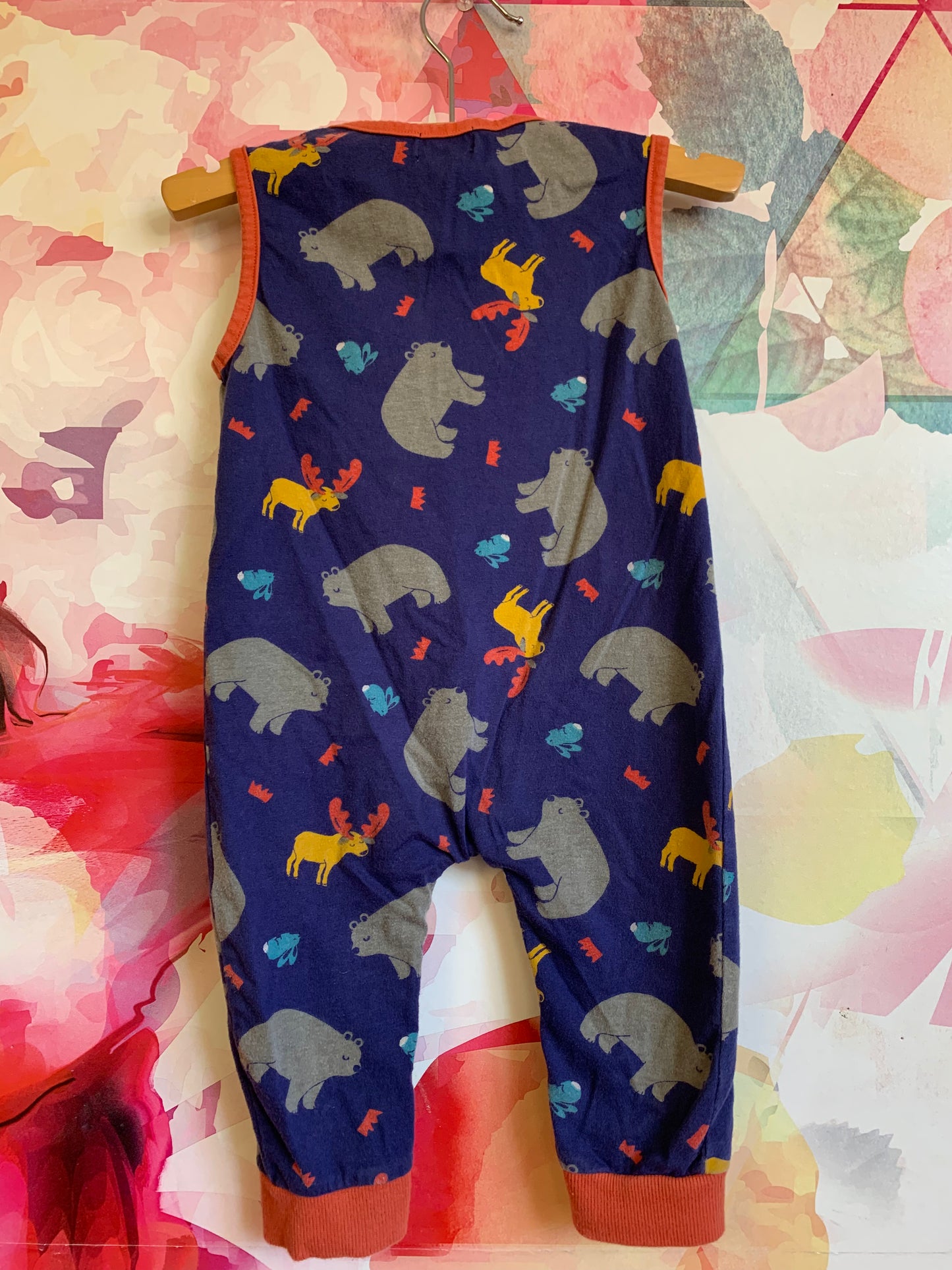 Lilly & Sid blue sleeveless romper with orange piping and animals and front pocket. Size 6-12m
