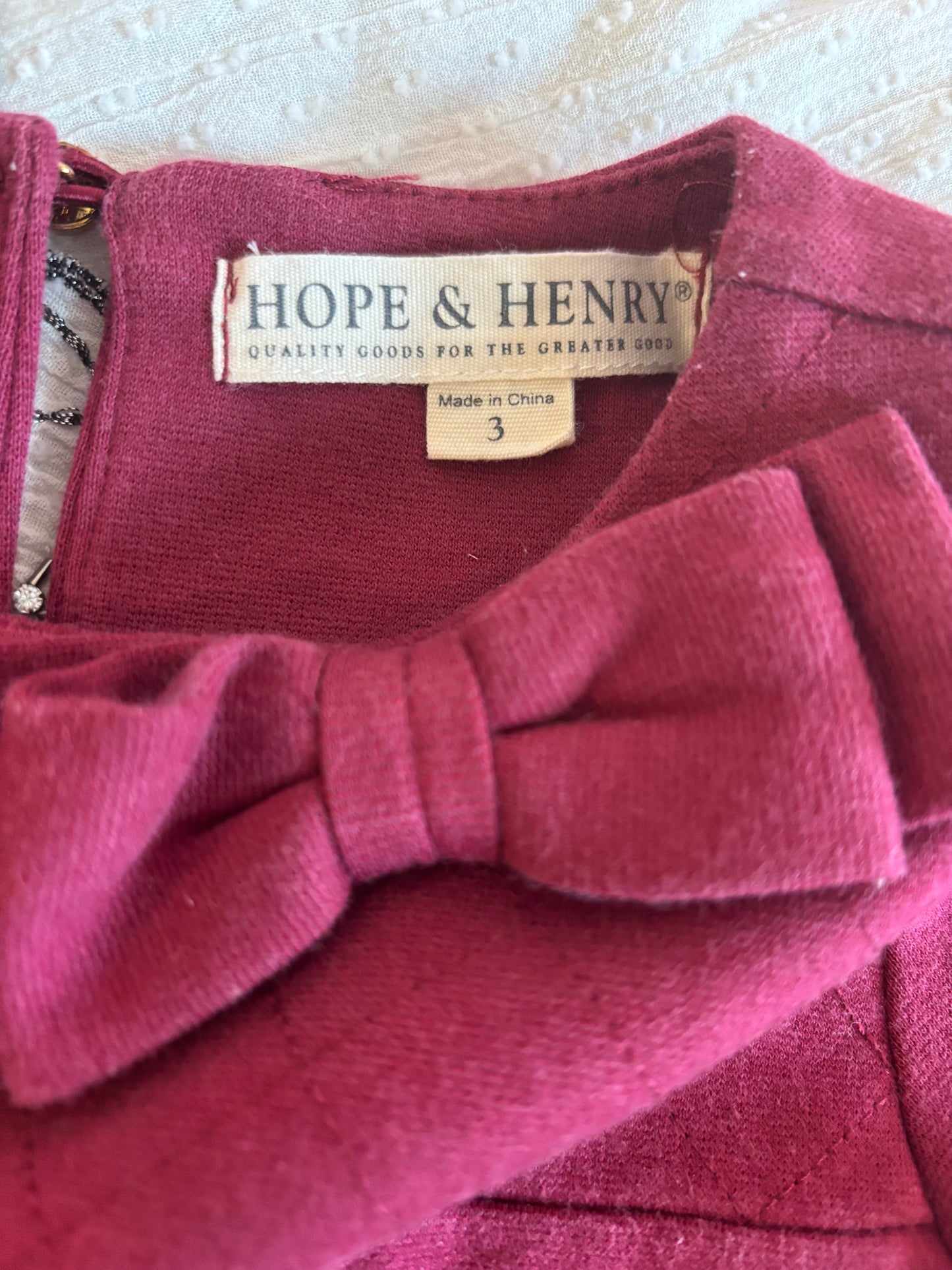 Hope & Henry burgundy dress with quilting on top, bow at neck, two front pockets and brown suede elbow pads. Size 3T