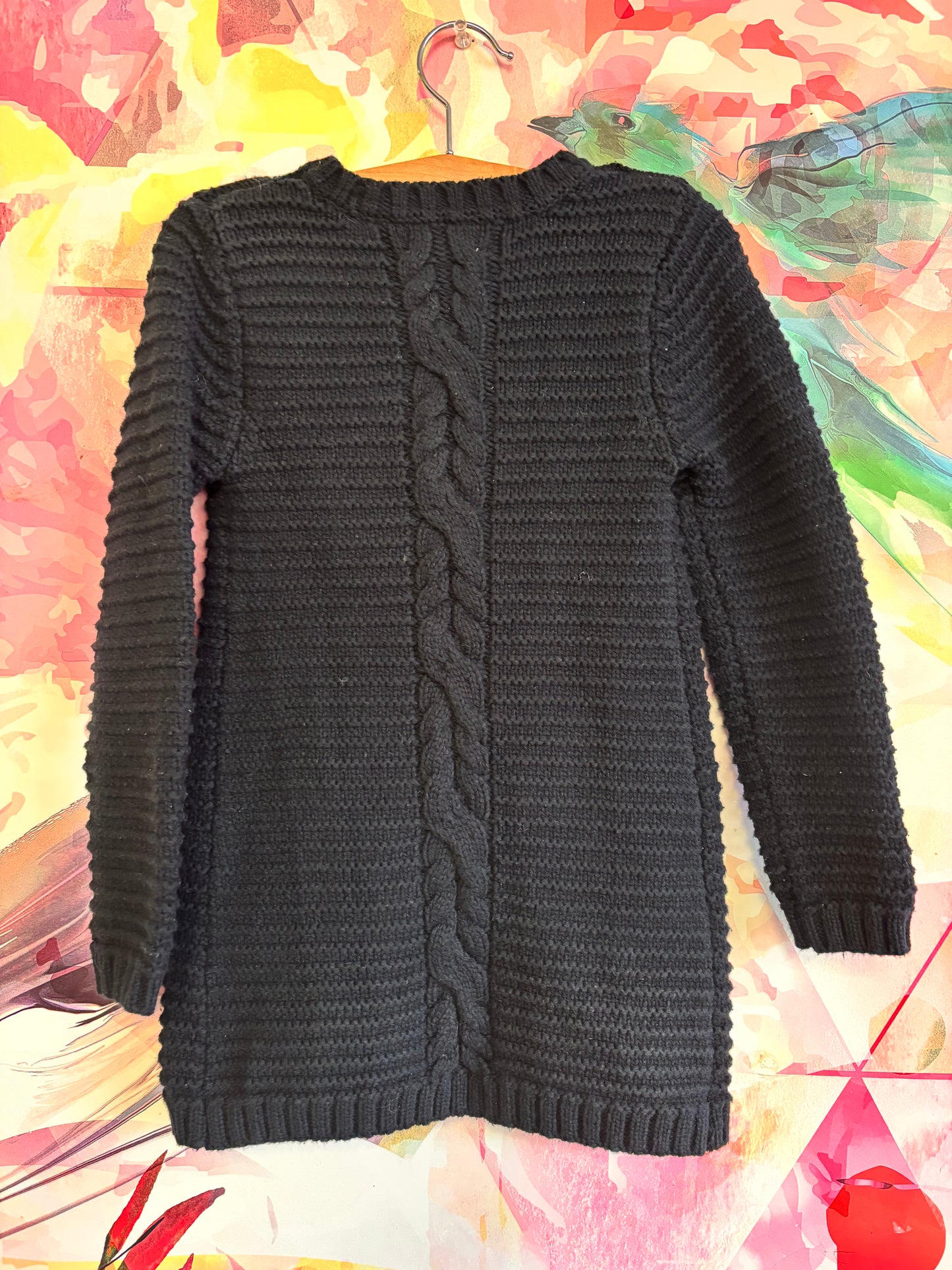 Tahari black knit knee length sweater with three snaps under white bows. Size 5T.