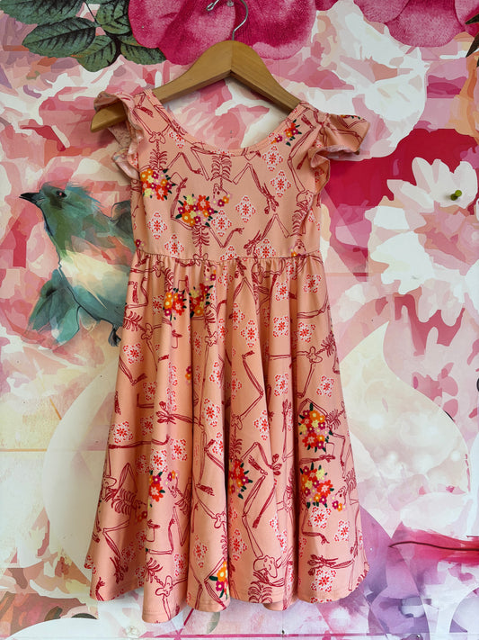 Dot Dot Smile orange flutter sleeve Halloween dress with skeletons and flowers. Size 3T.