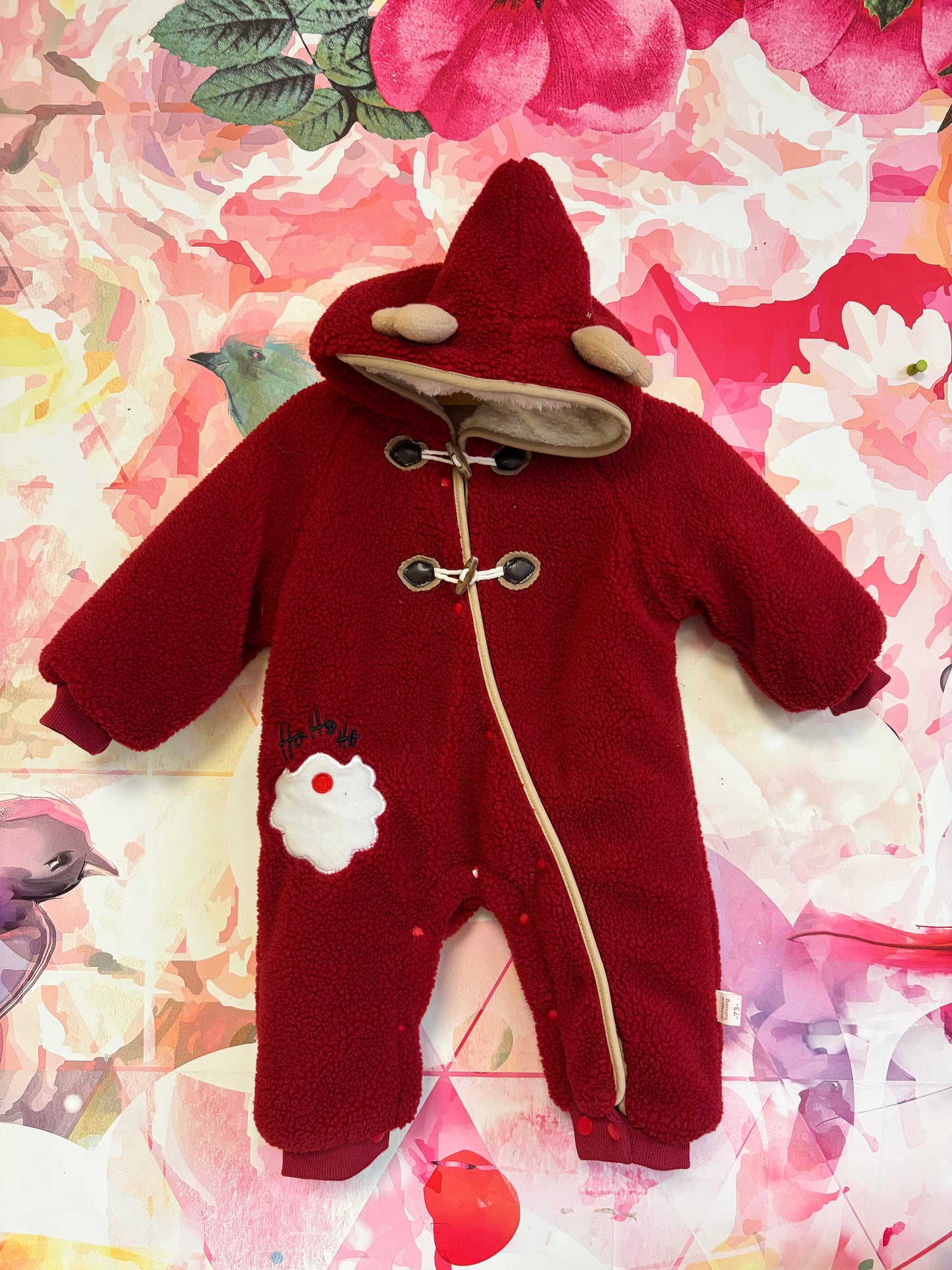 Red fleece faux fur lined bunting with zipper & toggle buttons. Hood has reindeer antlers. Ho Ho Ho Santa beard on suit. Size 3-6m