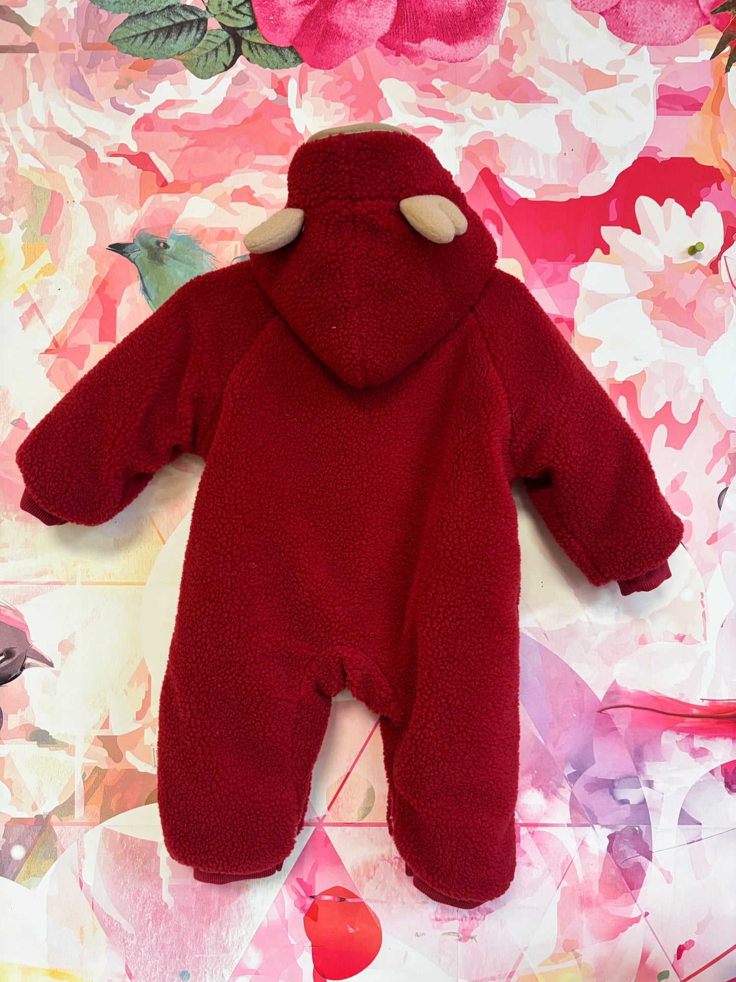 Red fleece faux fur lined bunting with zipper & toggle buttons. Hood has reindeer antlers. Ho Ho Ho Santa beard on suit. Size 3-6m