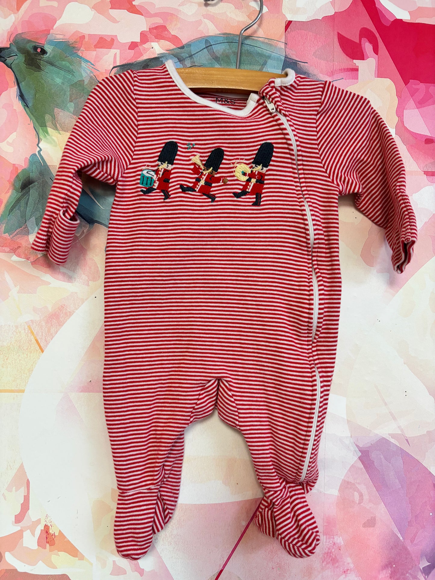 M&S red and white stripe romper with fold over hands and zipper. Size 0-3m NB