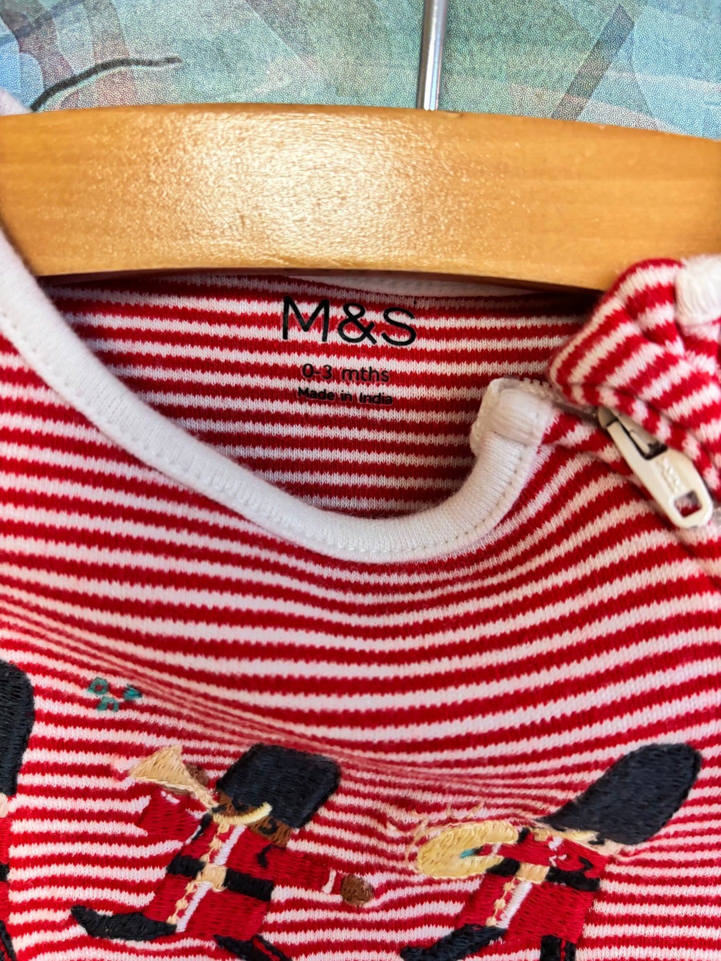 M&S red and white stripe romper with fold over hands and zipper. Size 0-3m NB